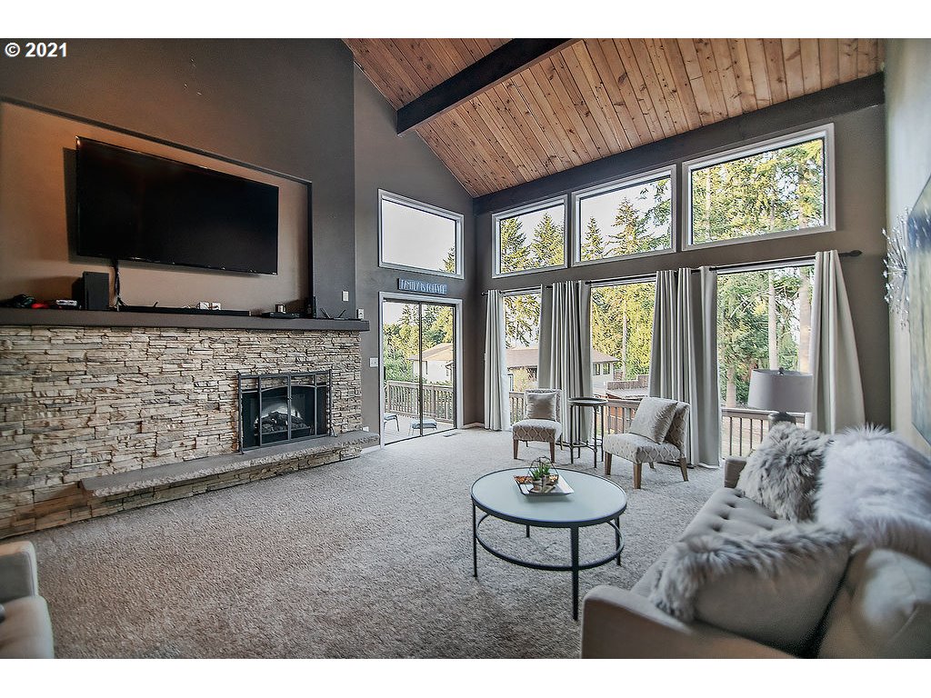 265 Curtis Hill Road Chehalis, WA 98532 - Photo 5 of 32 a living room with furniture a flat screen tv and a fireplace