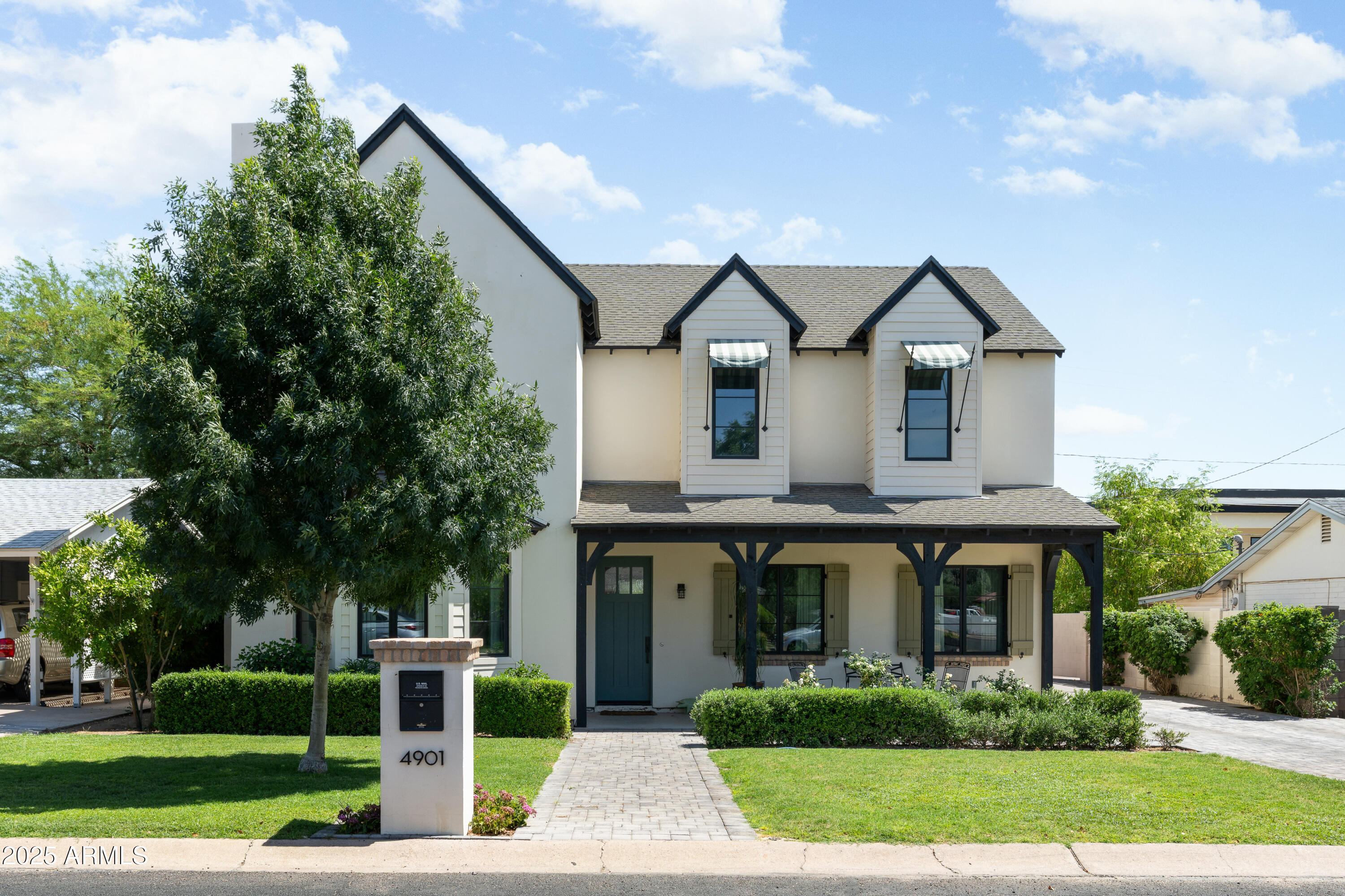 a front view of house with yard and green space