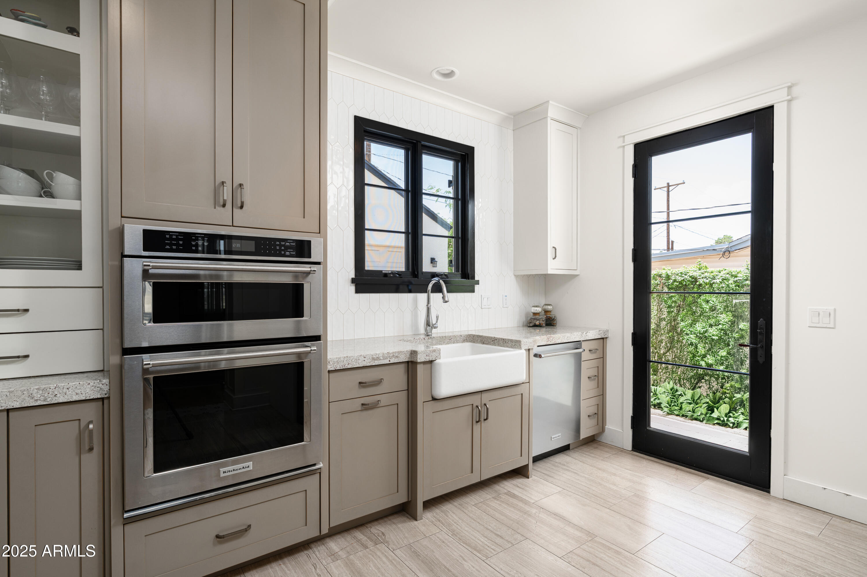 4901 East Amelia Avenue Phoenix, AZ 85018 - Photo 13 of 38 a kitchen with a stove oven and sink