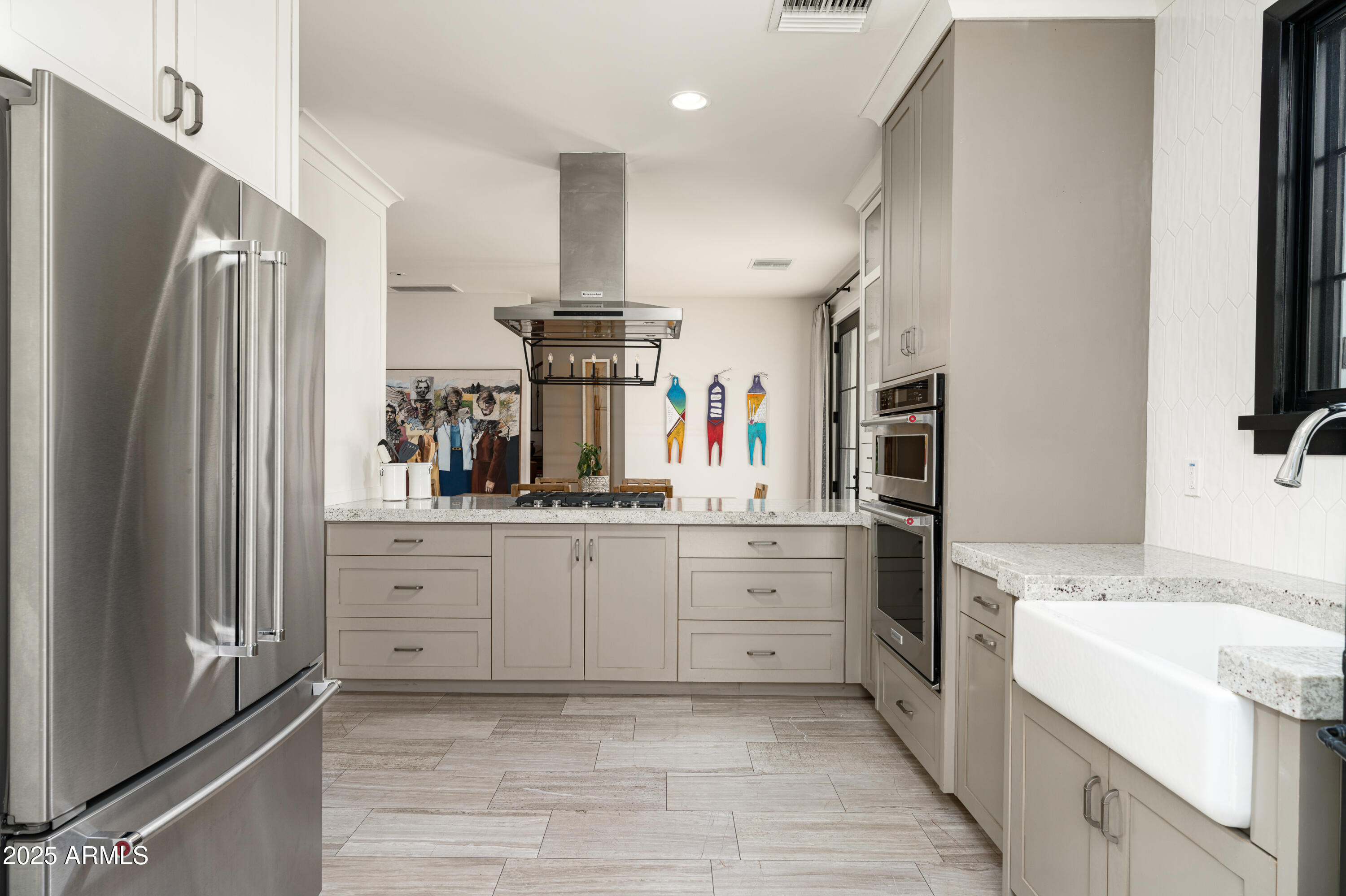 4901 East Amelia Avenue Phoenix, AZ 85018 - Photo 14 of 38 a kitchen with sink cabinets and refrigerator