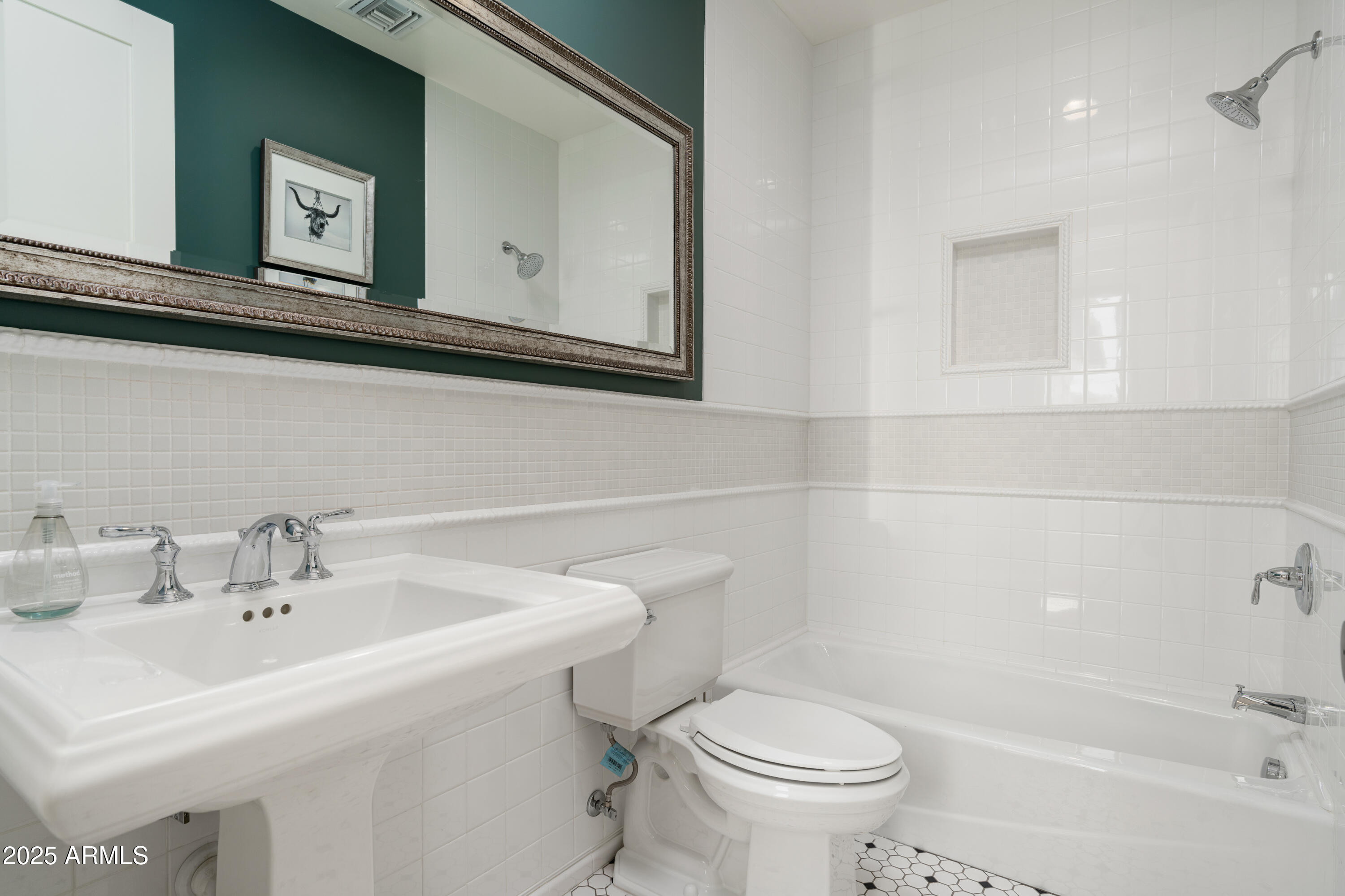 4901 East Amelia Avenue Phoenix, AZ 85018 - Photo 16 of 38 a bathroom with a sink mirror and toilet