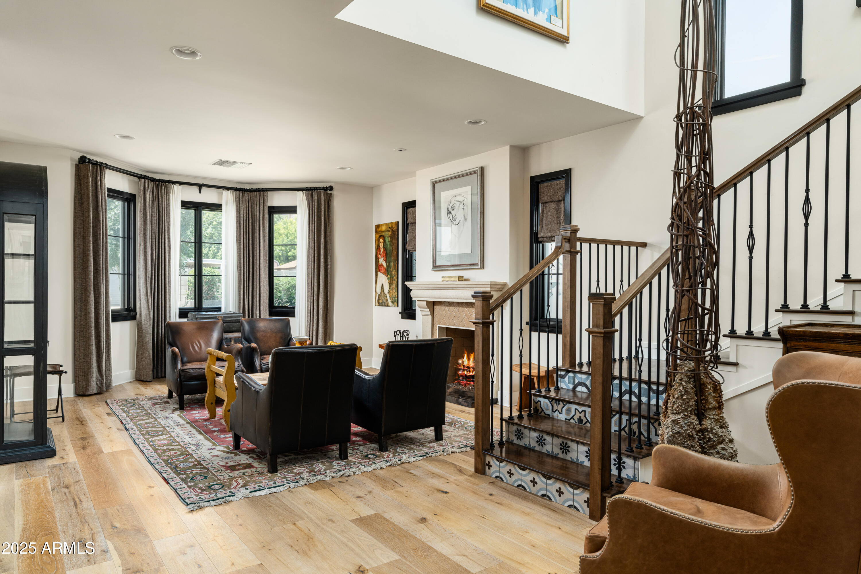 4901 East Amelia Avenue Phoenix, AZ 85018 - Photo 17 of 38 a view of a livingroom with furniture and floor to ceiling window