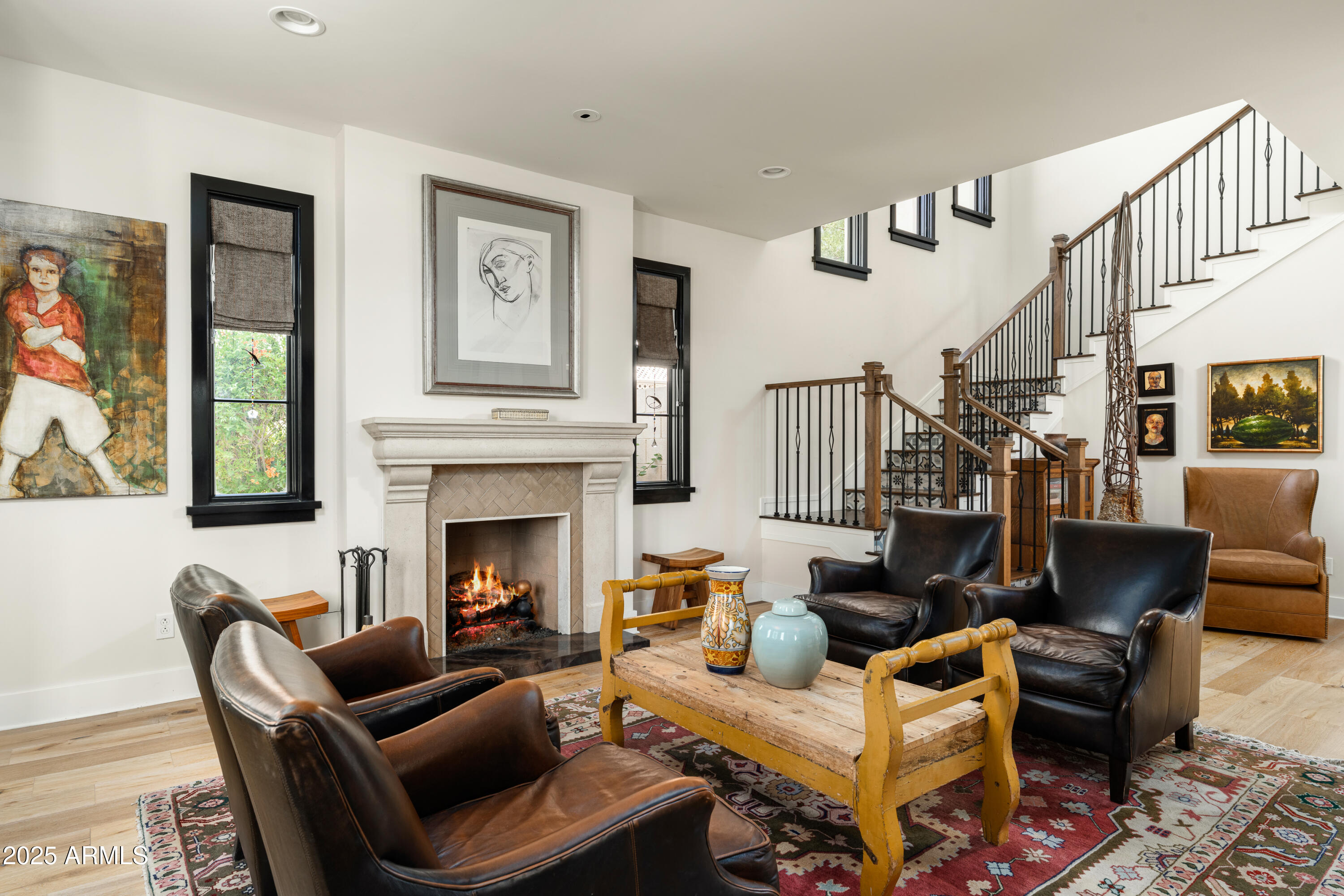 4901 East Amelia Avenue Phoenix, AZ 85018 - Photo 18 of 38 a living room with furniture fireplace and a window