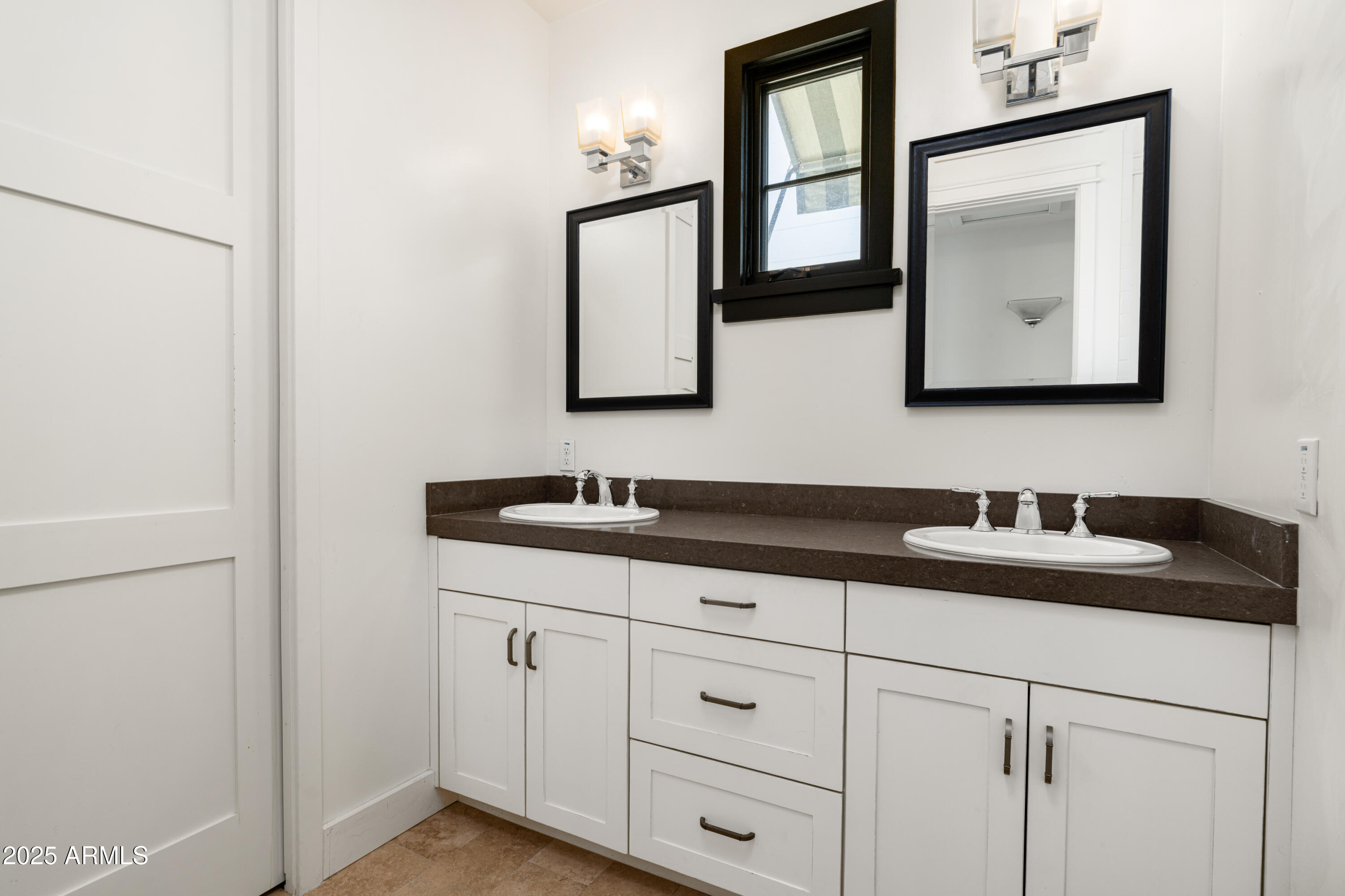 4901 East Amelia Avenue Phoenix, AZ 85018 - Photo 29 of 38 a bathroom with a granite countertop sink and a mirror