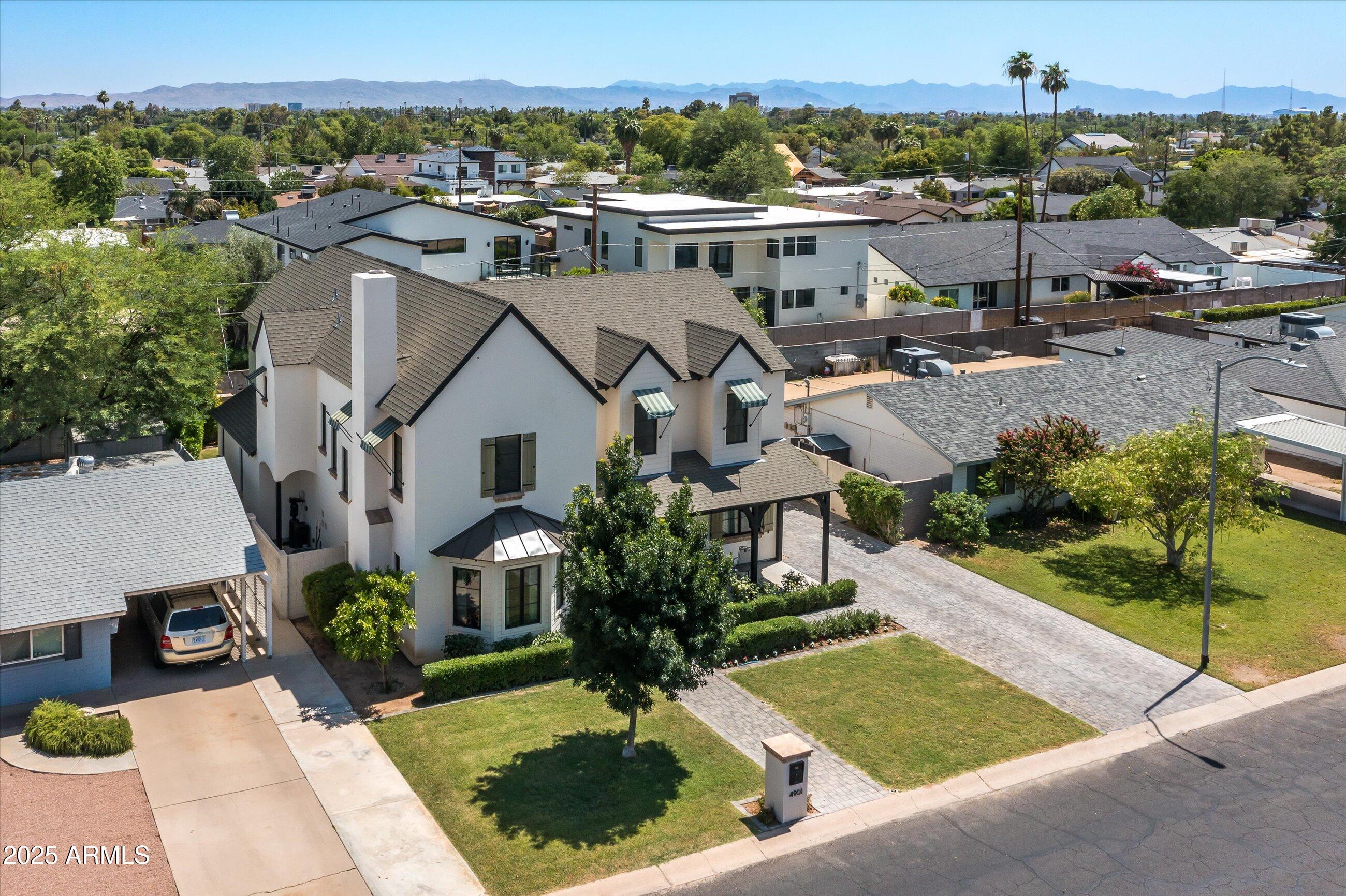 4901 East Amelia Avenue Phoenix, AZ 85018 - Photo 37 of 38 a aerial view of a house with a yard and plants