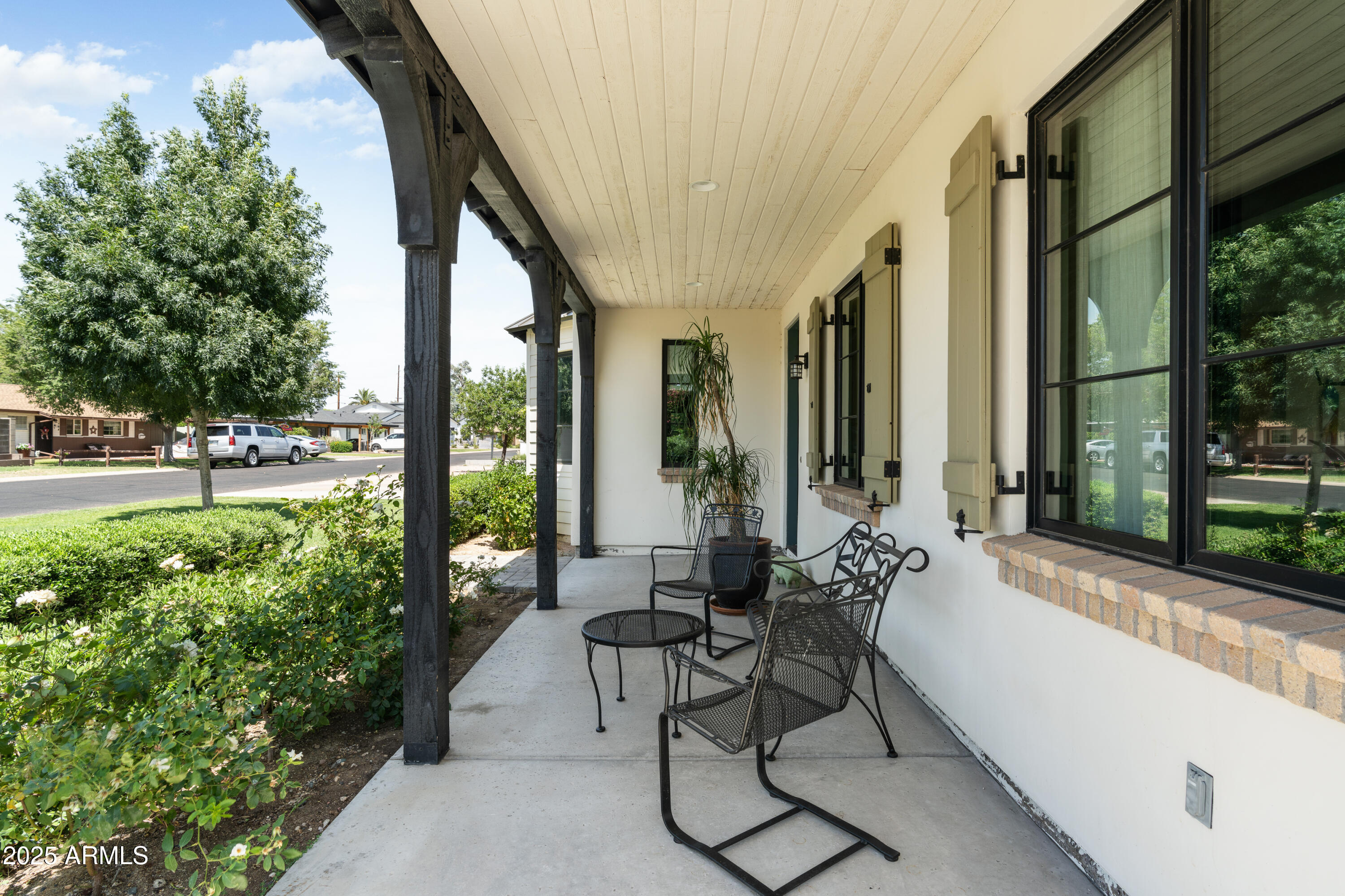 4901 East Amelia Avenue Phoenix, AZ 85018 - Photo 5 of 38 a building outdoor space with patio furniture and garden