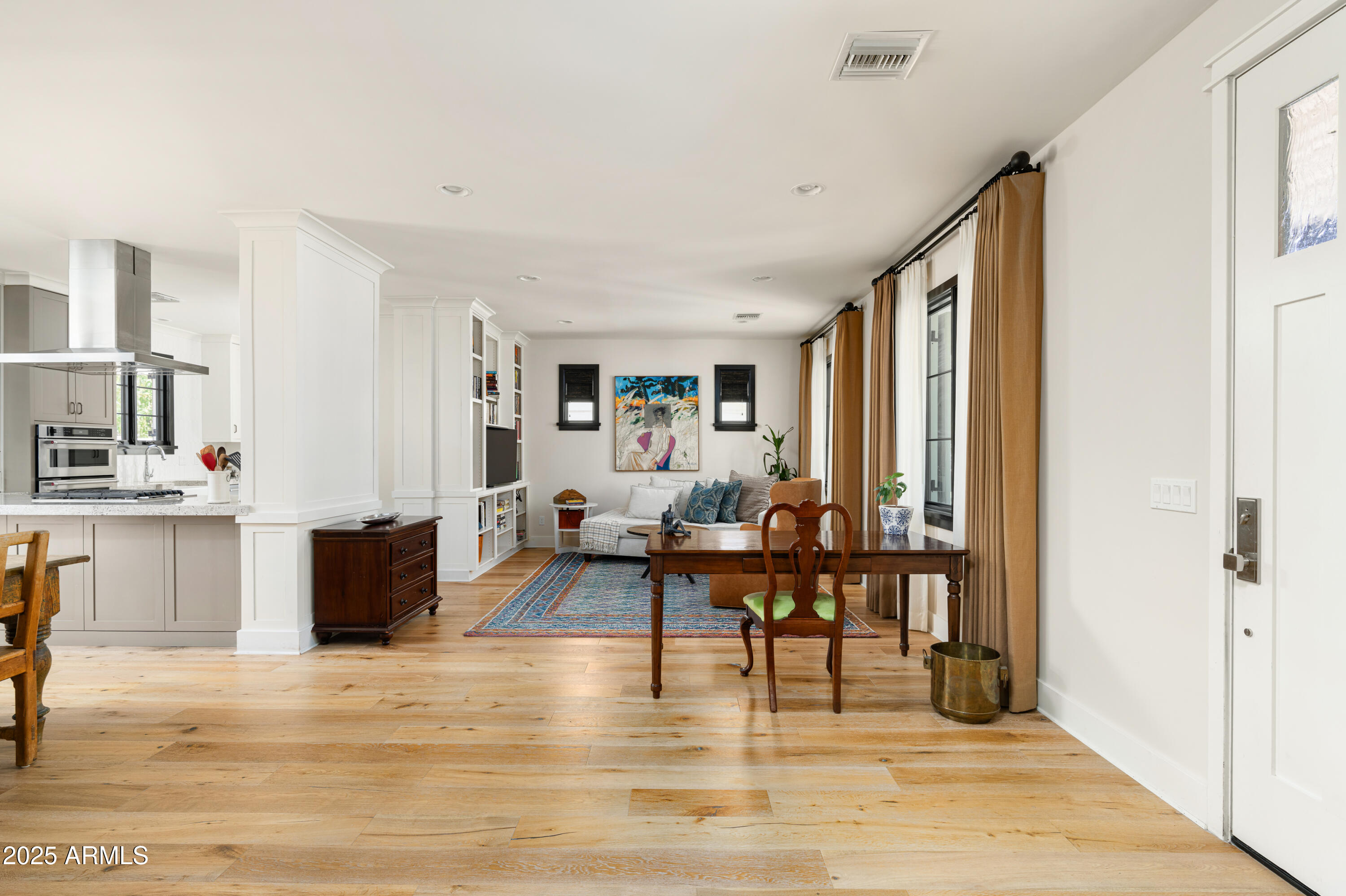 4901 East Amelia Avenue Phoenix, AZ 85018 - Photo 7 of 38 a living room with furniture and a wooden floor