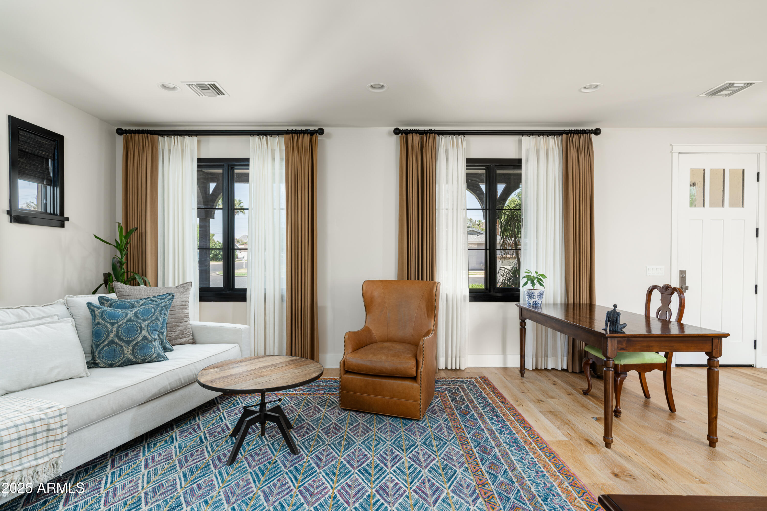 4901 East Amelia Avenue Phoenix, AZ 85018 - Photo 9 of 38 a living room with furniture and a table