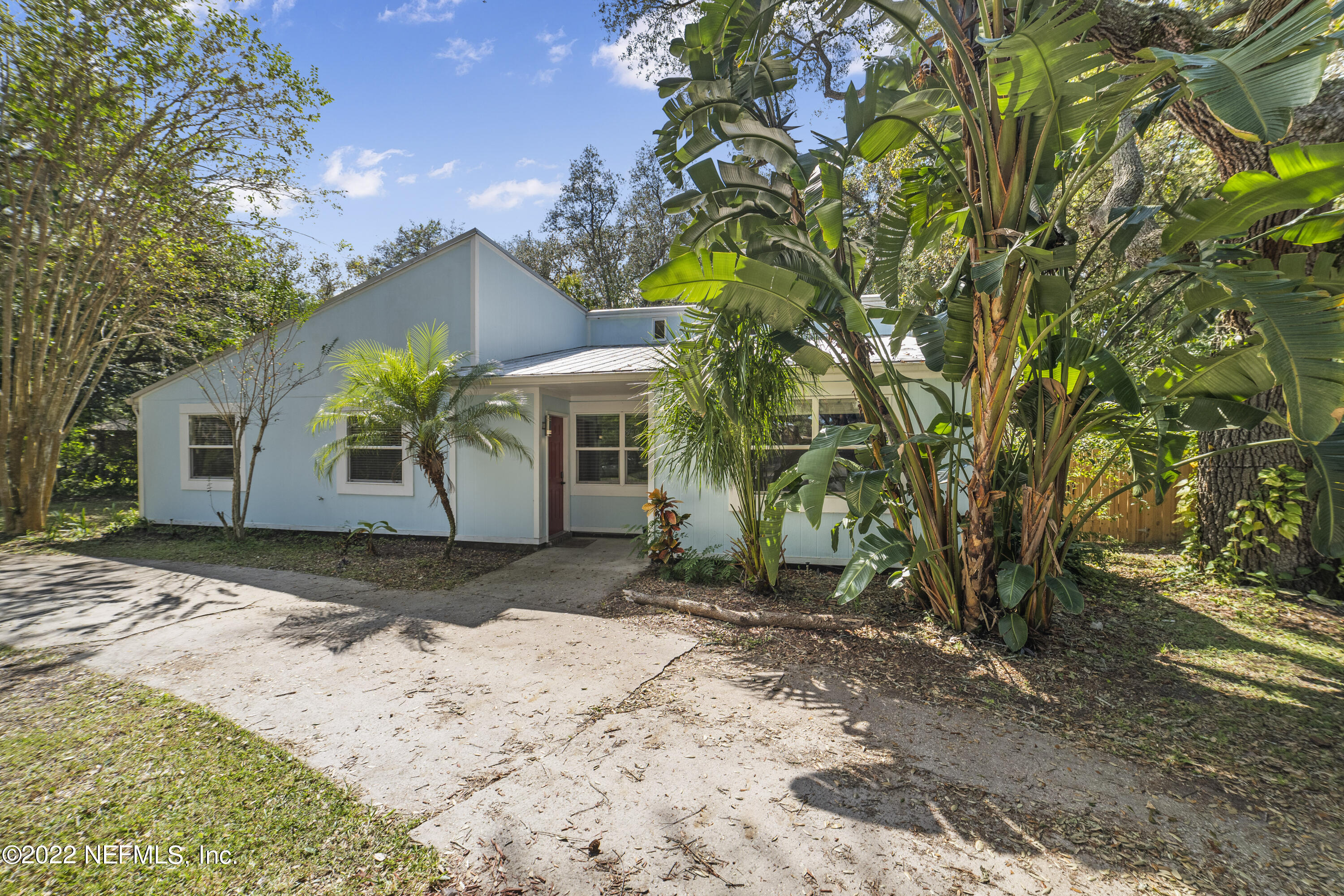 914 Prince Road St. Augustine, FL 32086 - Photo 1 of 26 a front view of a house with a yard and garage