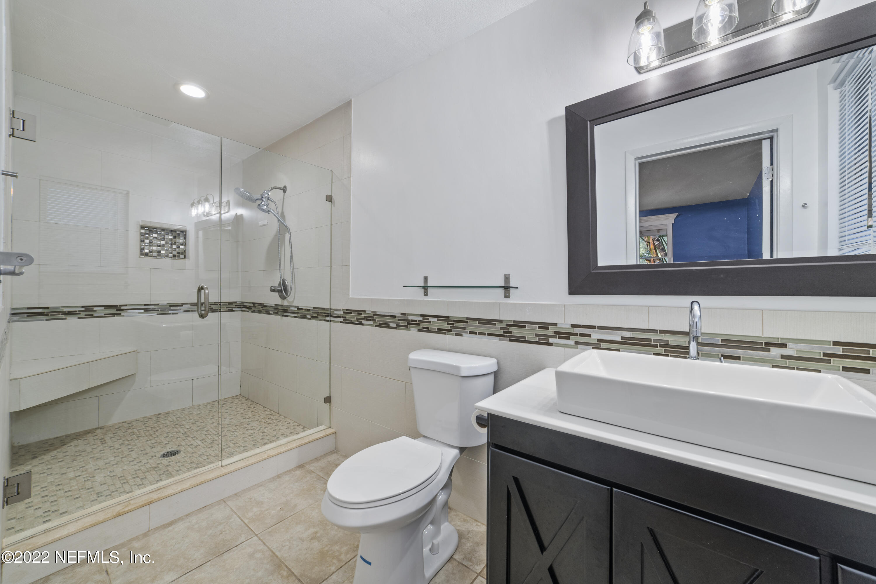 914 Prince Road St. Augustine, FL 32086 - Photo 11 of 26 a bathroom with a sink toilet and shower