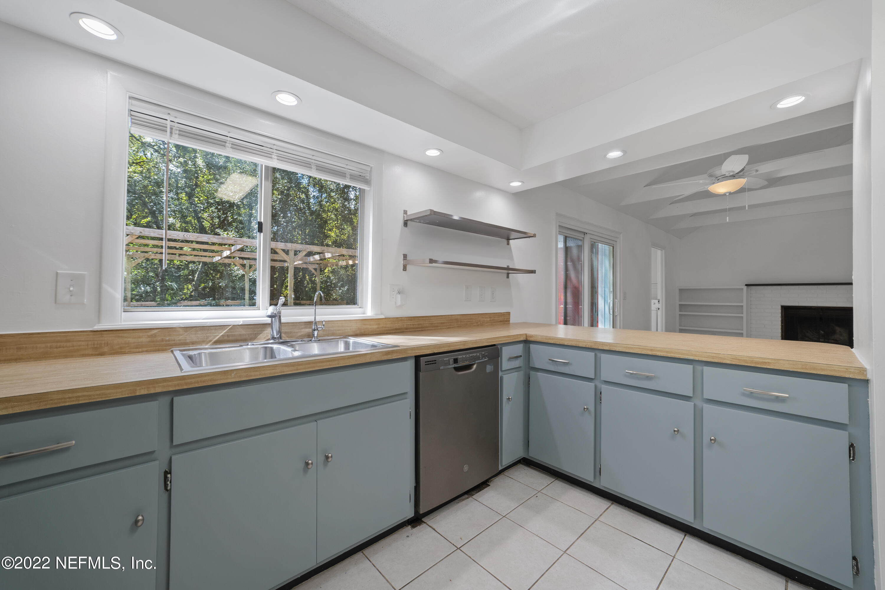 914 Prince Road St. Augustine, FL 32086 - Photo 20 of 26 a kitchen with a sink and large window