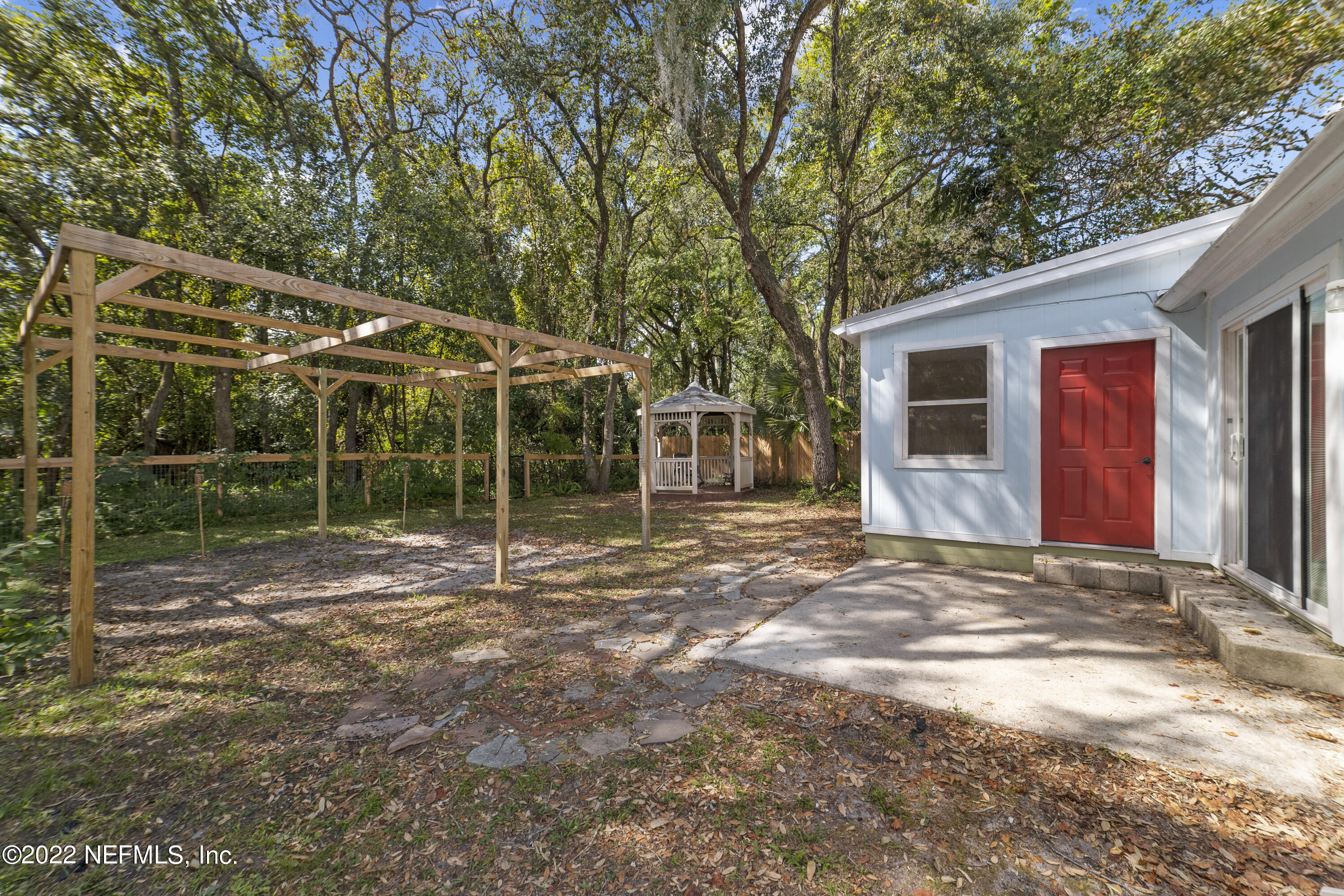 914 Prince Road St. Augustine, FL 32086 - Photo 4 of 26 a view of a house with backyard and porch