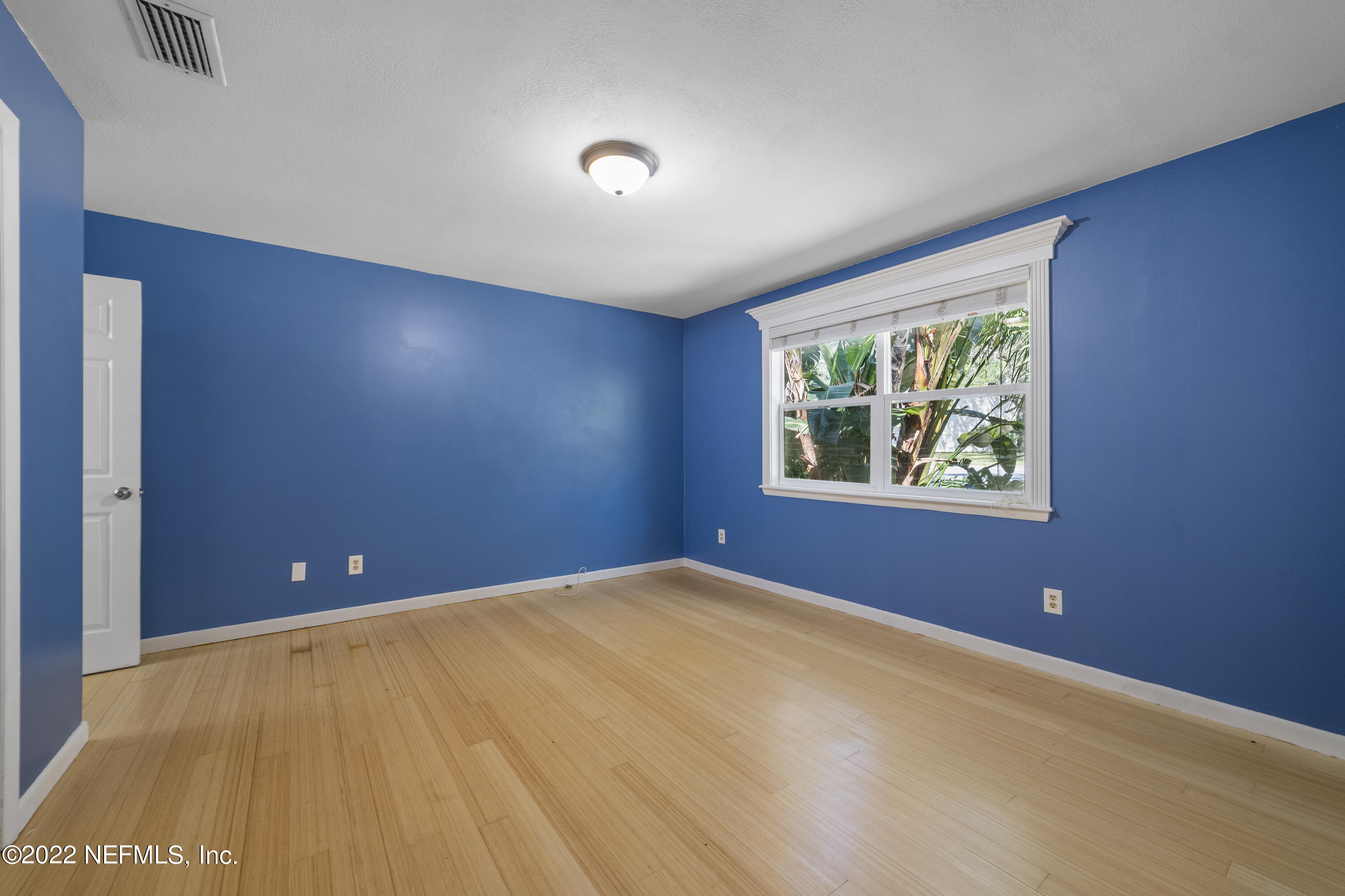 914 Prince Road St. Augustine, FL 32086 - Photo 8 of 26 a view of an empty room with window and air conditioner vent