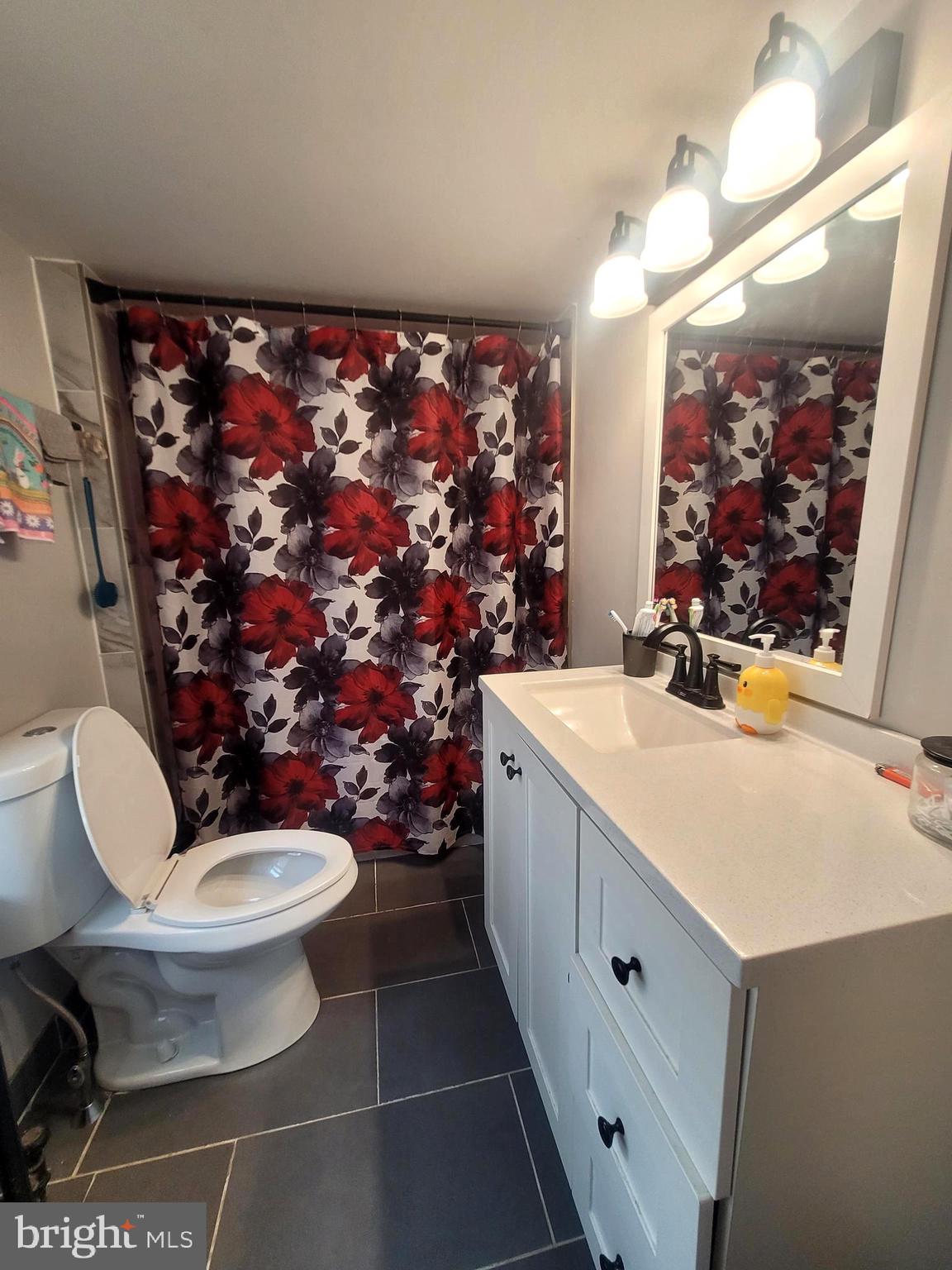 574 Bath Street Bristol, PA 19007 - Photo 11 of 23 a bathroom with a toilet sink and mirror
