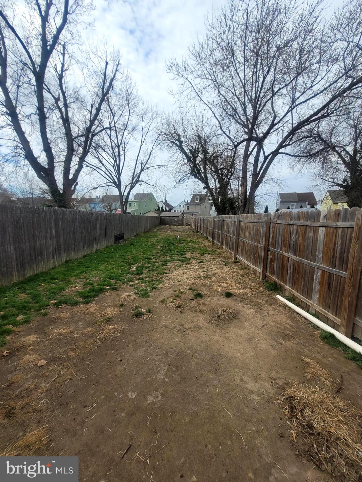 574 Bath Street Bristol, PA 19007 - Photo 23 of 23 a view of backyard with wooden fence