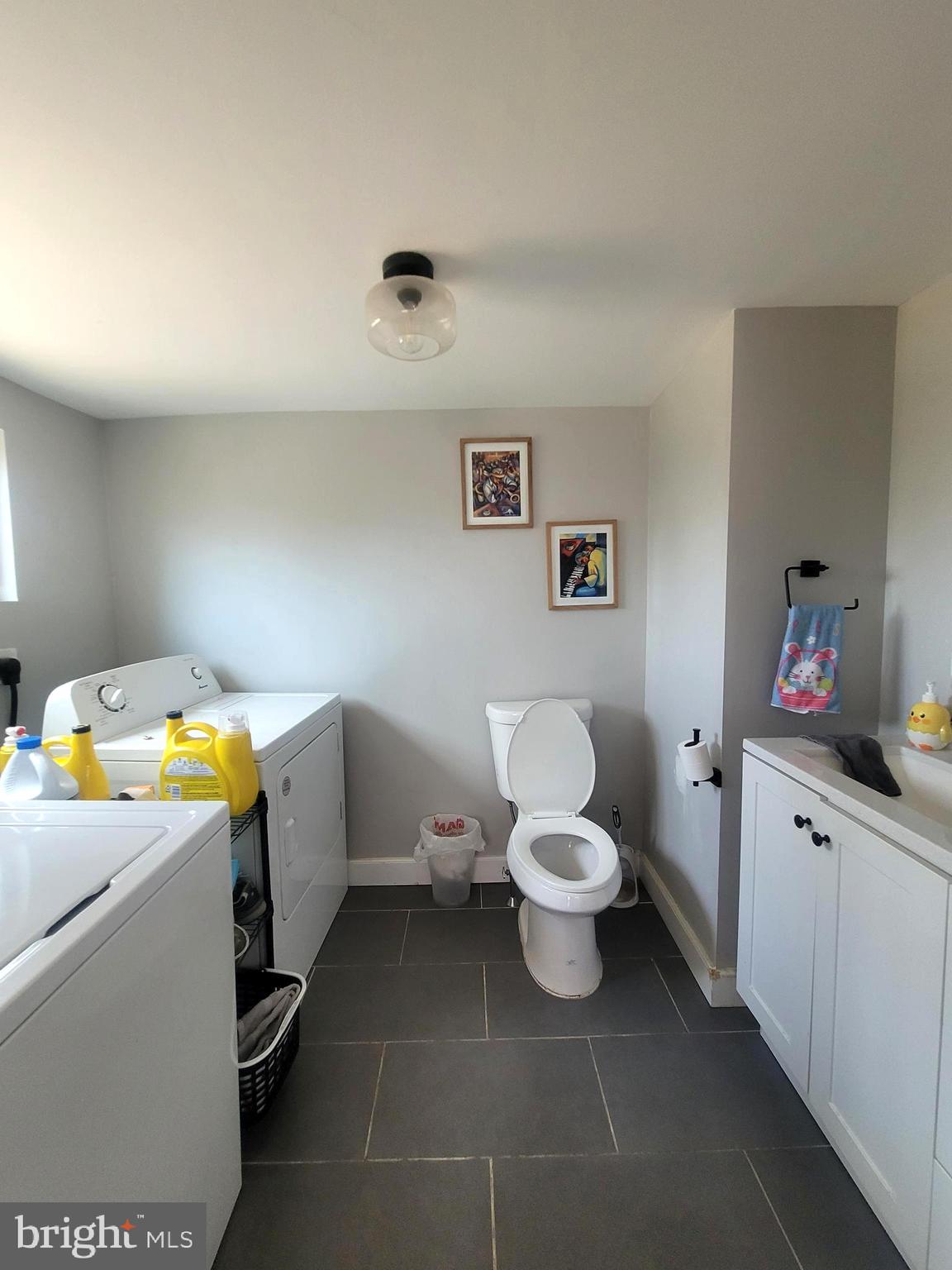574 Bath Street Bristol, PA 19007 - Photo 6 of 23 a bathroom with a sink toilet vanity and tub