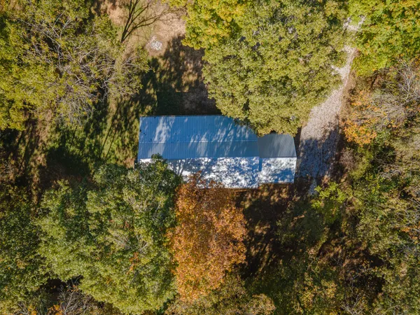 a view of a porch with wooden floor and fence