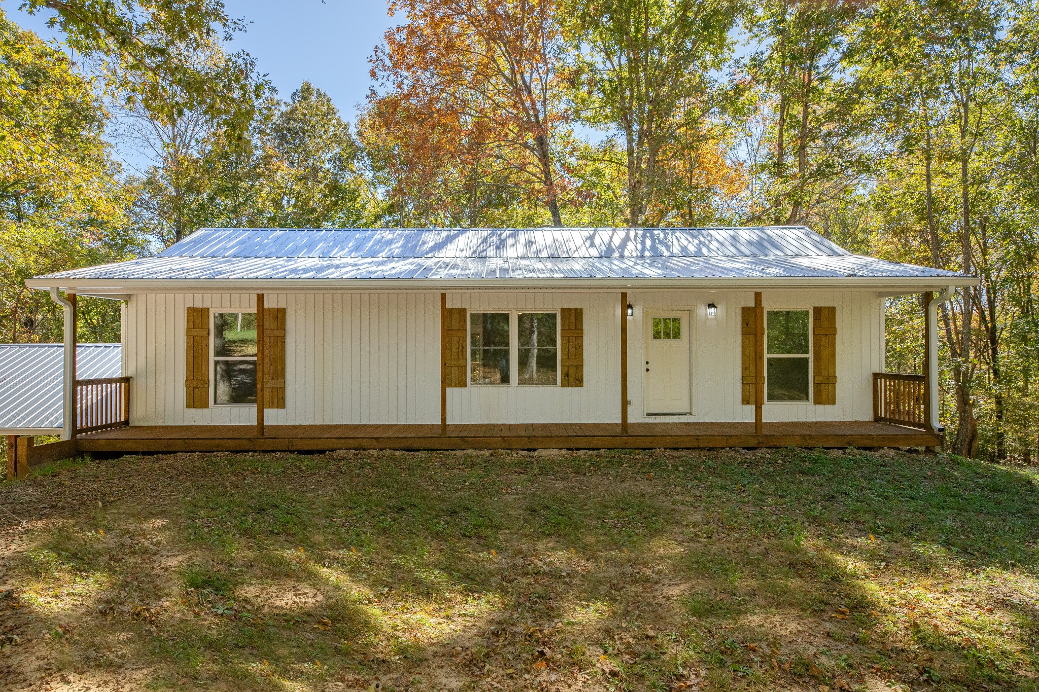 8240 Charlie Brown Road Centerville, TN 37033 - Photo 14 of 72 a front view of a house with a garden