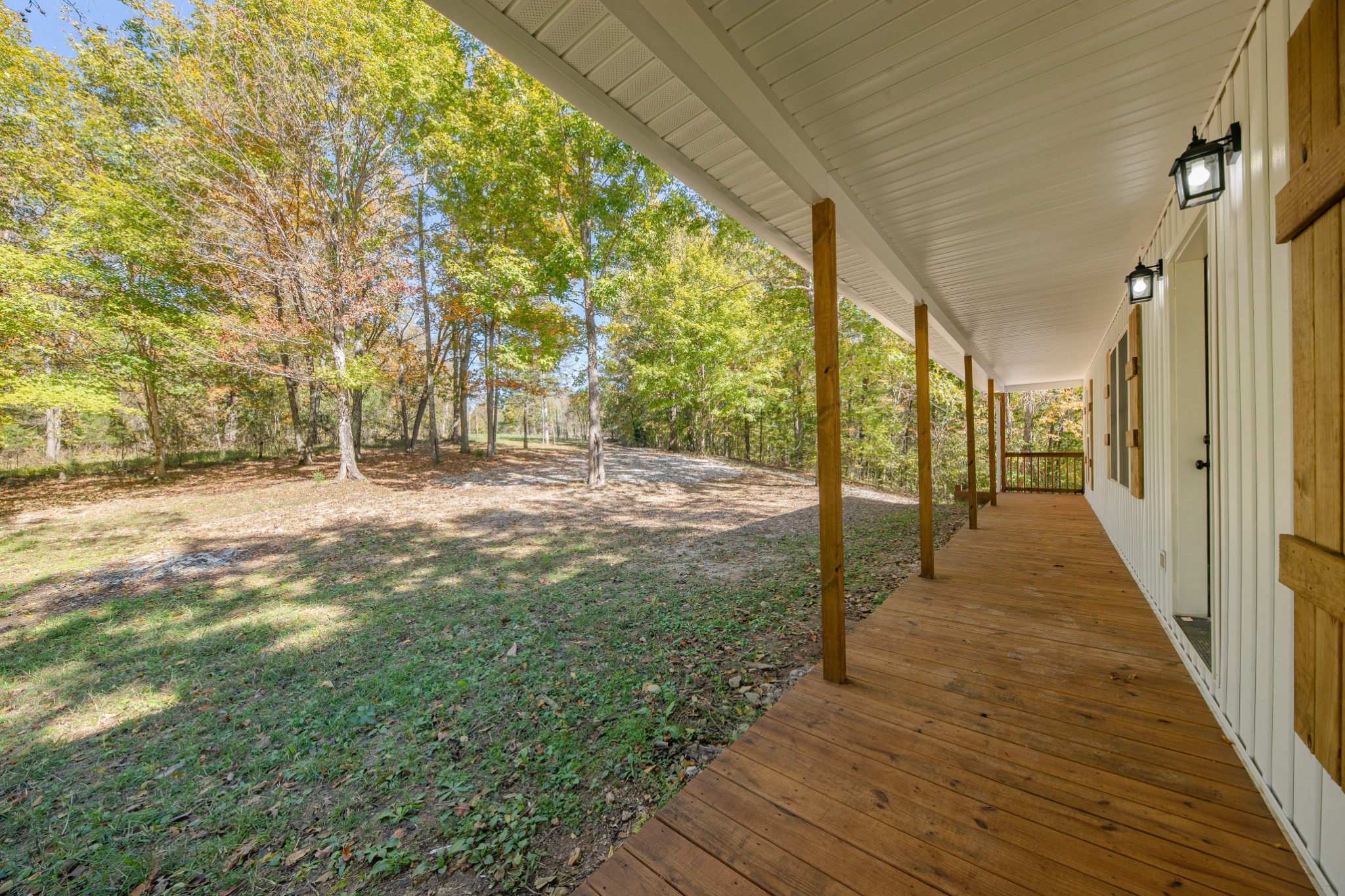 8240 Charlie Brown Road Centerville, TN 37033 - Photo 16 of 72 a view of a porch with wooden floor and fence