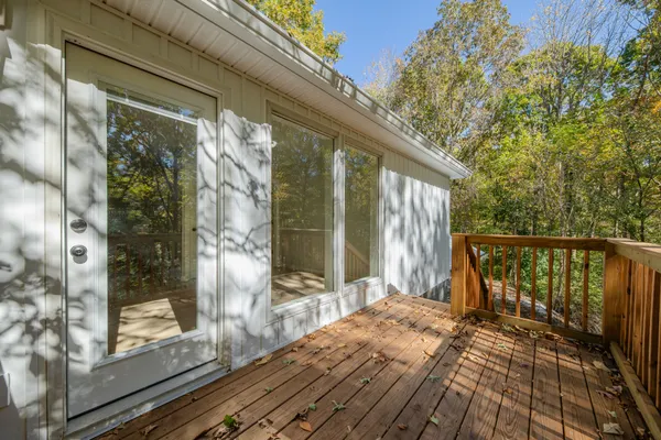 a kitchen with stainless steel appliances granite countertop a sink and cabinets with wooden floor
