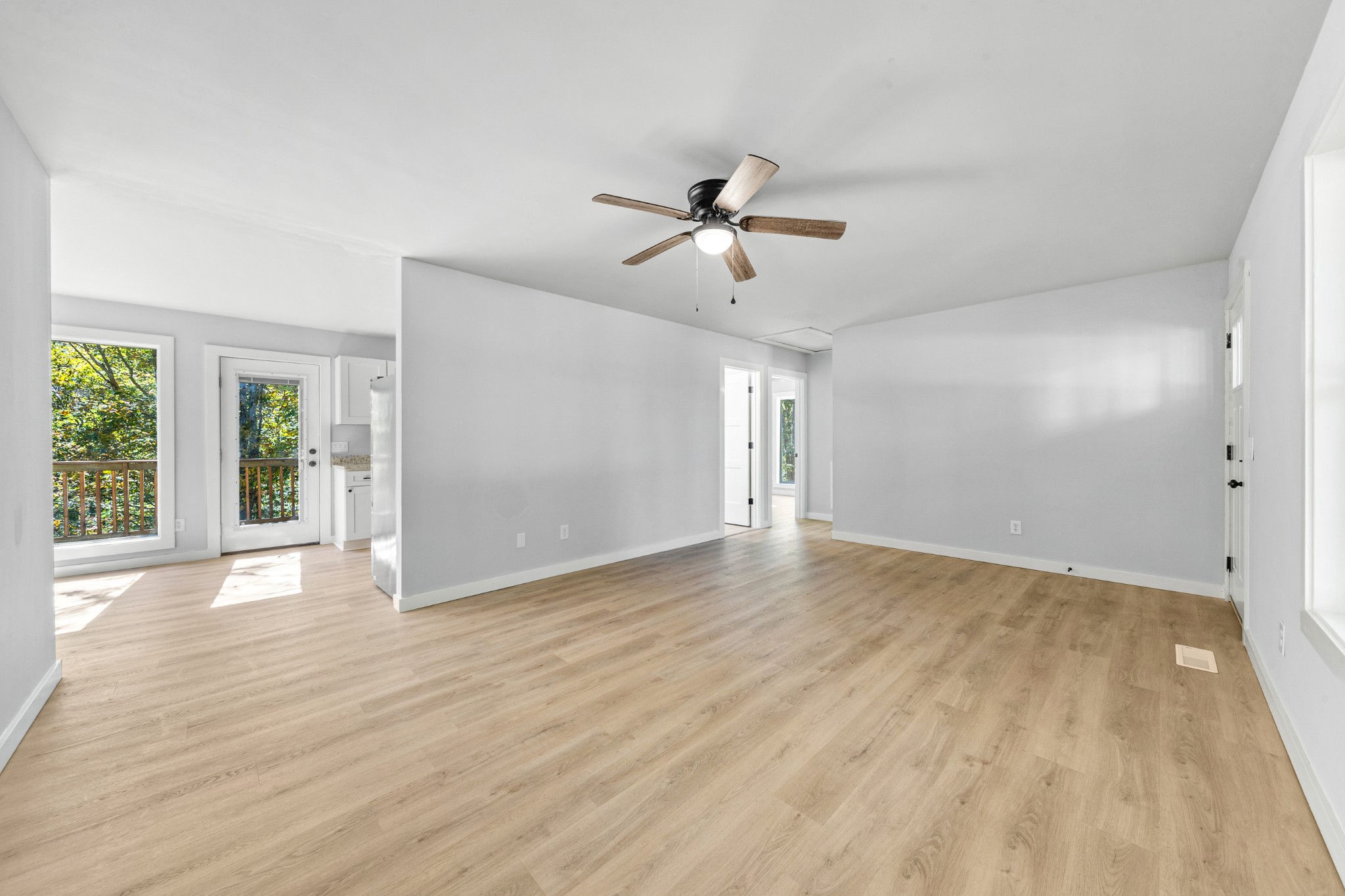 8240 Charlie Brown Road Centerville, TN 37033 - Photo 22 of 72 a view of empty room with wooden floor and fan
