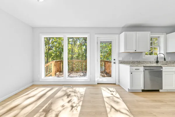 a view of an empty room with a window