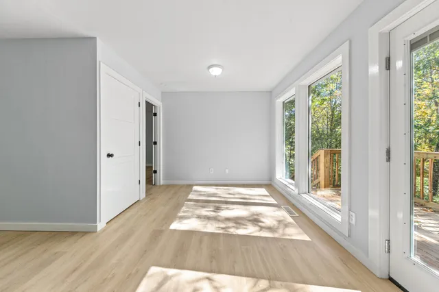 a view of an empty room with a window