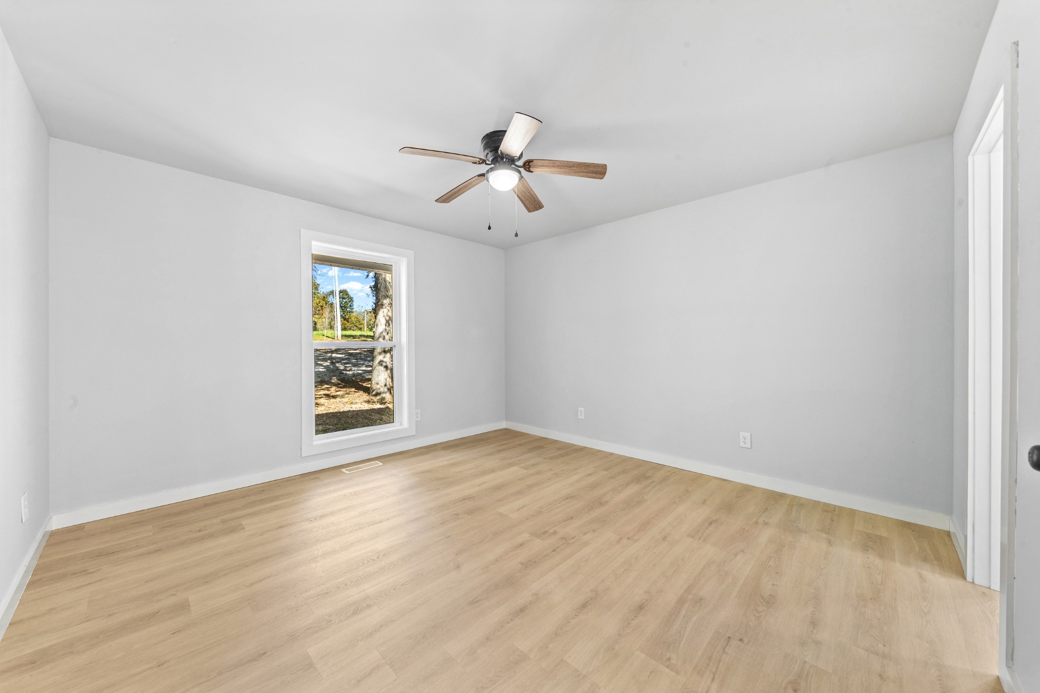 8240 Charlie Brown Road Centerville, TN 37033 - Photo 31 of 72 an empty room with windows and fan