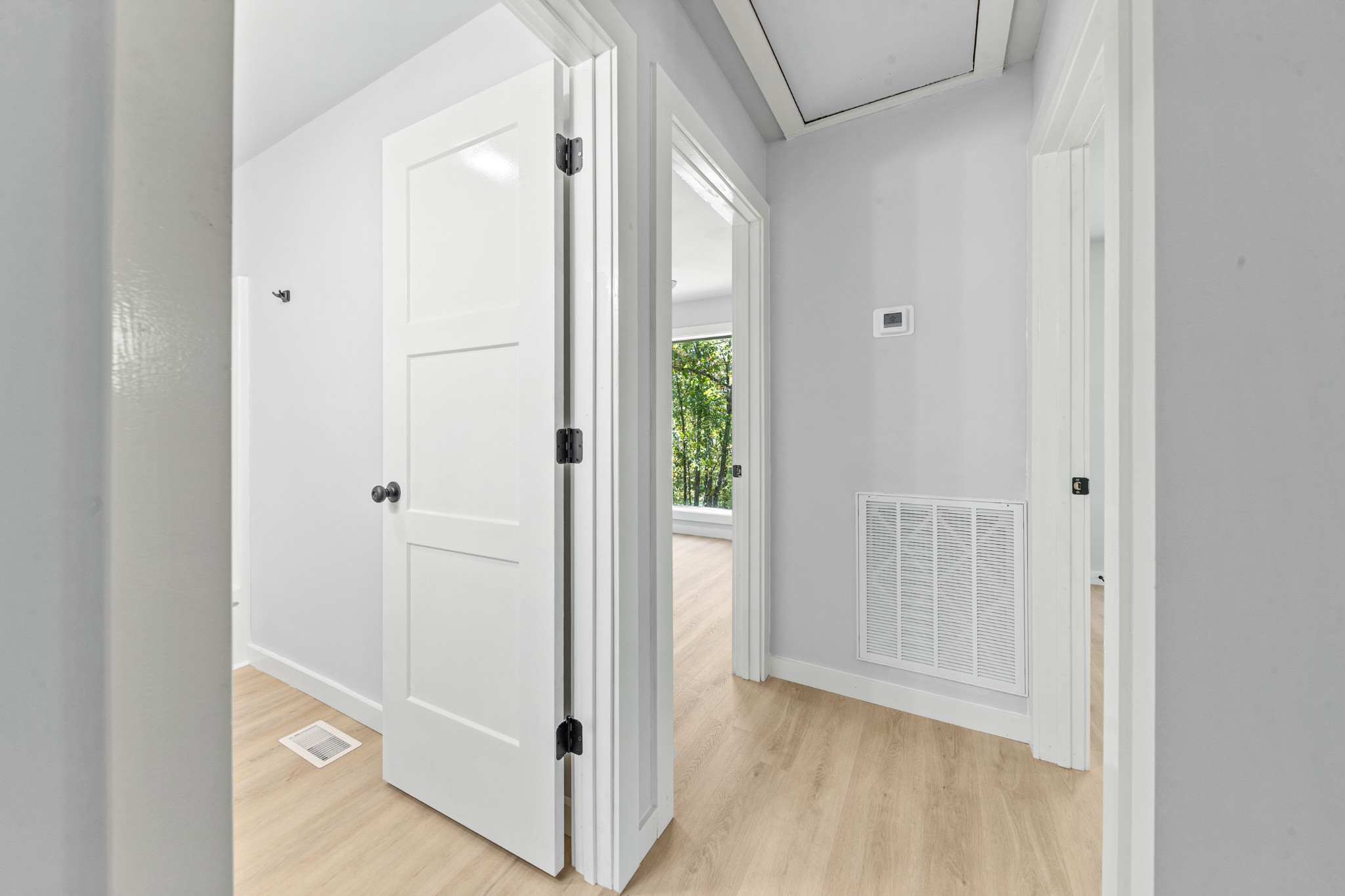 8240 Charlie Brown Road Centerville, TN 37033 - Photo 36 of 72 a view of a hallway with wooden floor and closet