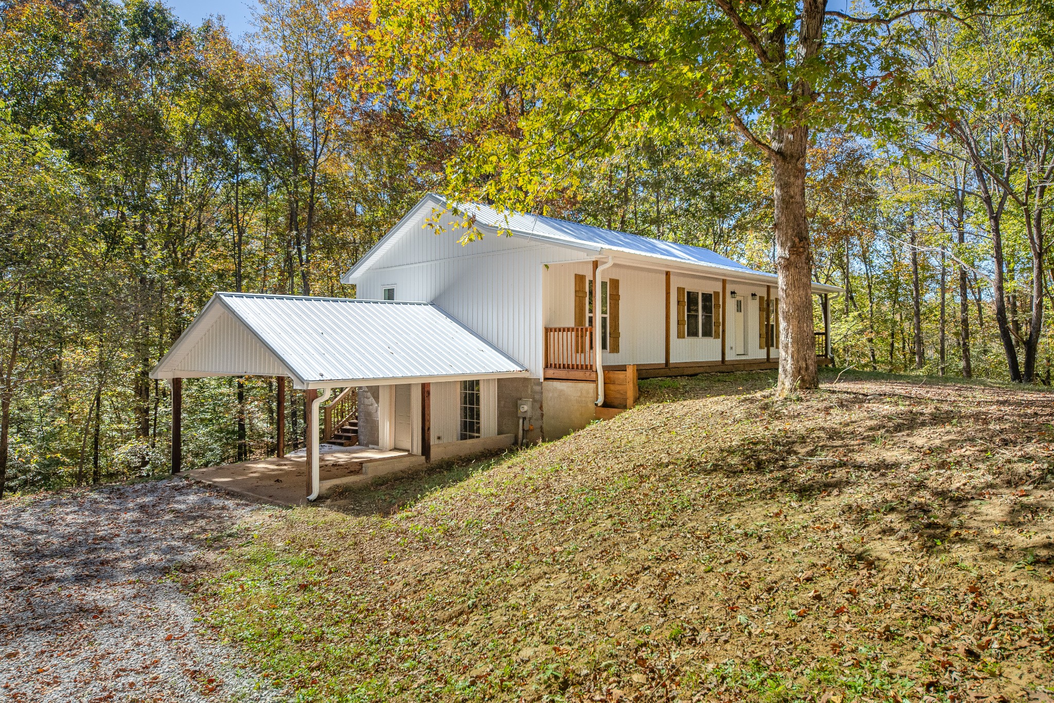 8240 Charlie Brown Road Centerville, TN 37033 - Photo 6 of 72 a house with trees in front of it