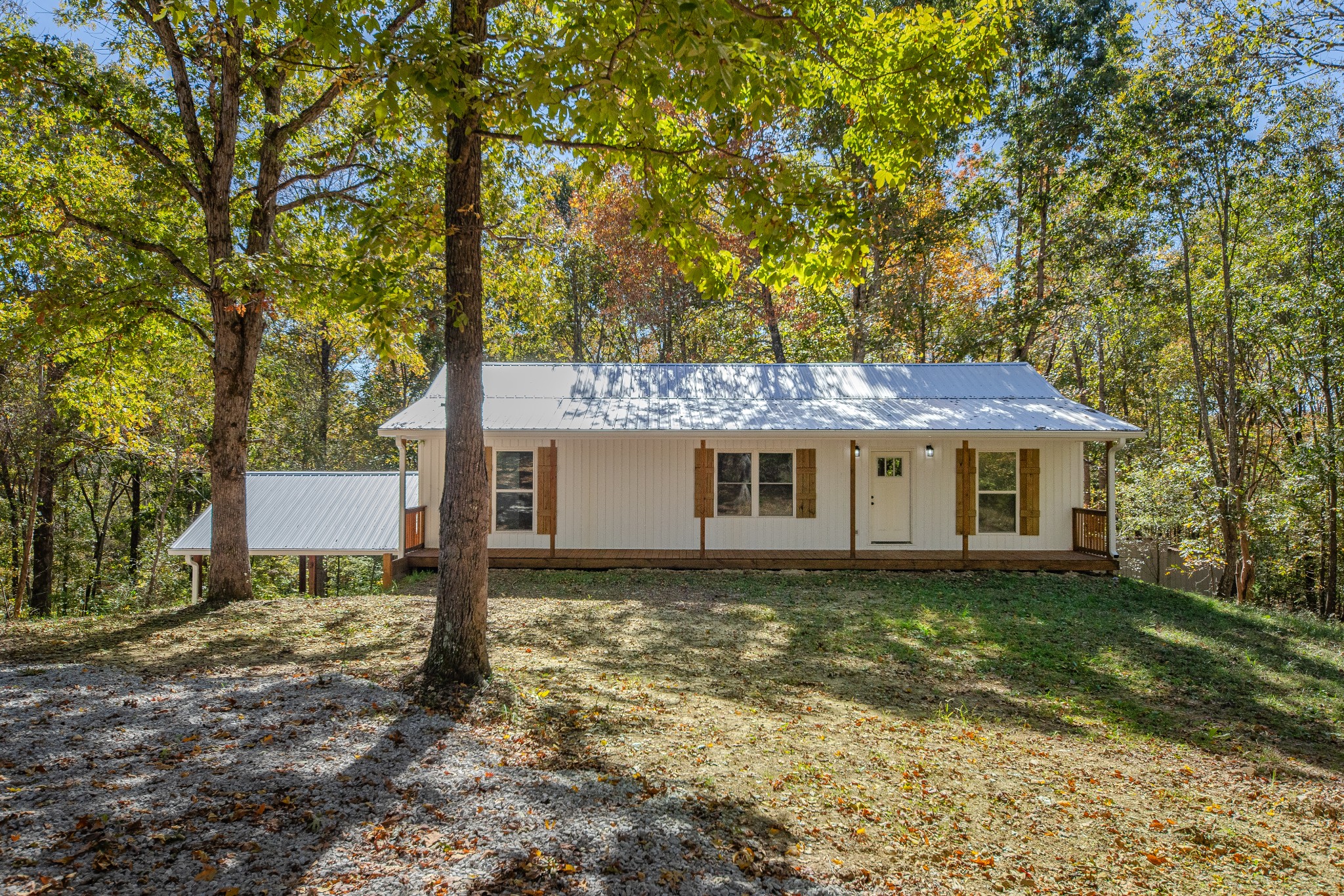 8240 Charlie Brown Road Centerville, TN 37033 - Photo 8 of 72 a house that has a tree in front of it