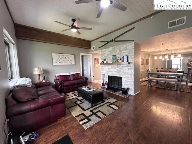 a living room with furniture fireplace and window