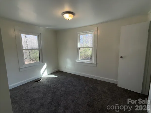 an empty room with windows