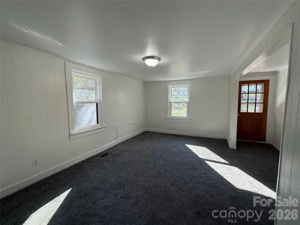 an empty room with windows