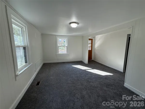 a view of empty room with windows