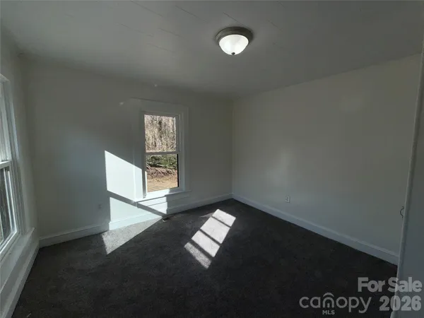 a view of an empty room and window