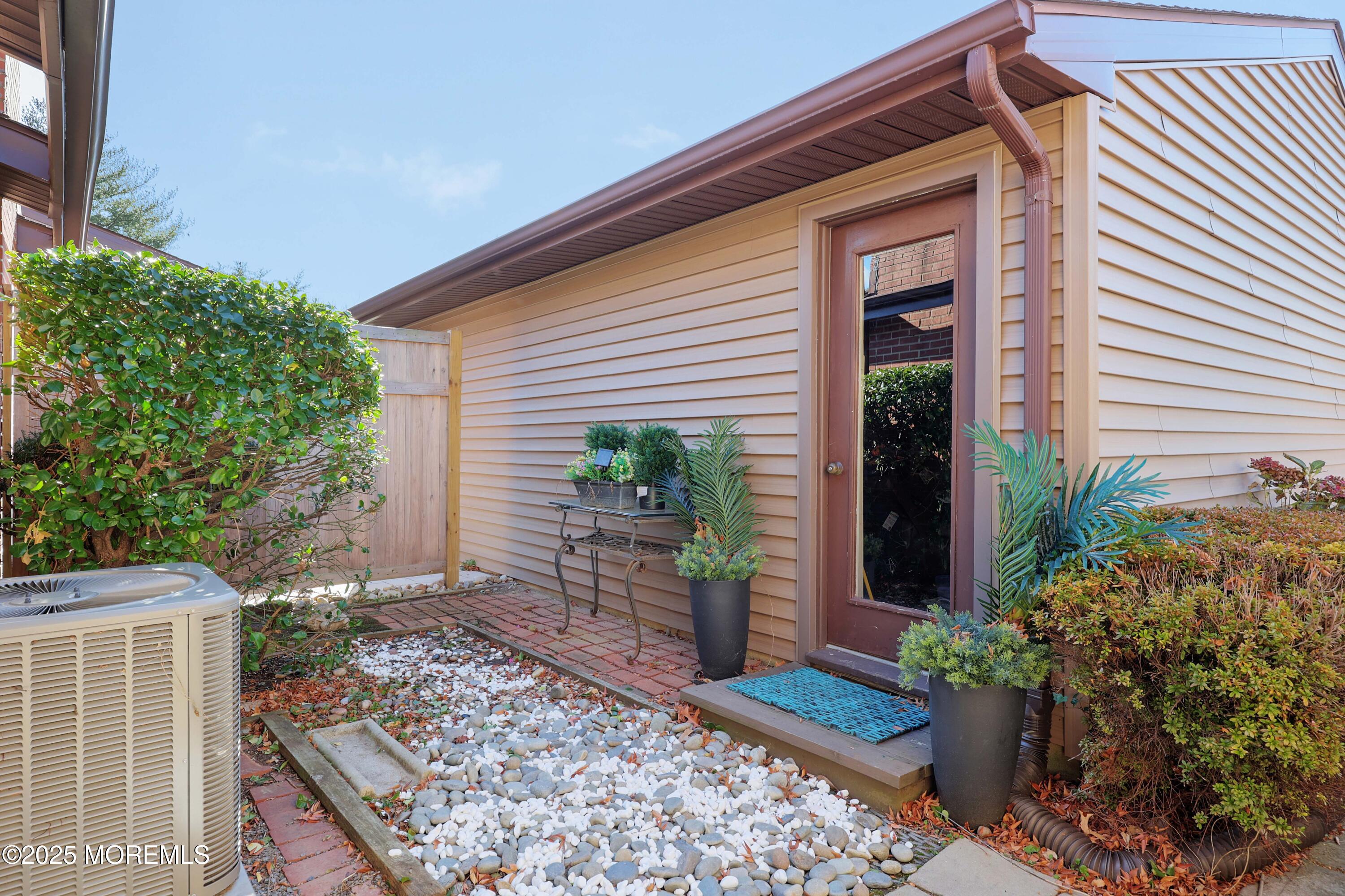 16 Concord Court Red Bank, NJ 07701 - Photo 14 of 63 a view of a house with potted plants