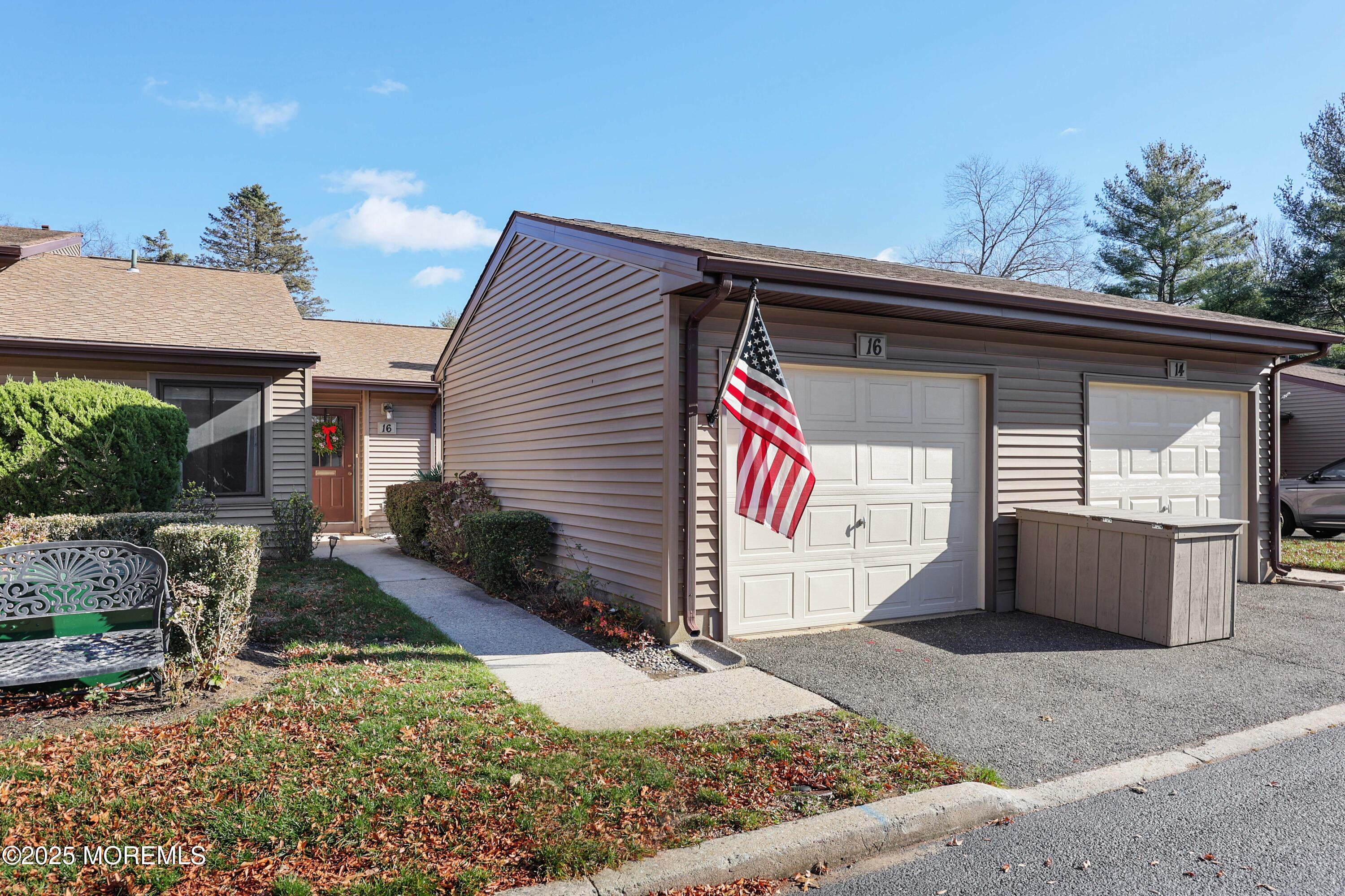 16 Concord Court Red Bank, NJ 07701 - Photo 28 of 63 a front view of house with yard and trees in the background
