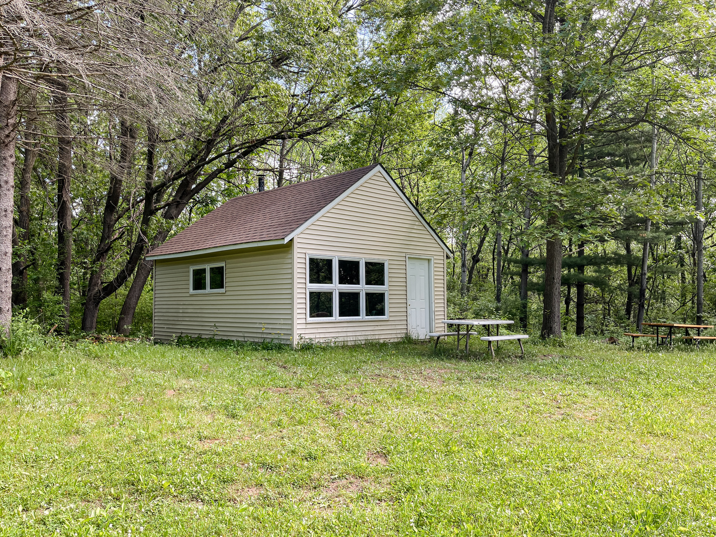0 Three Mile Road Savanna, IL 61074 - Photo 14 of 32 a backyard of a house with table and chairs