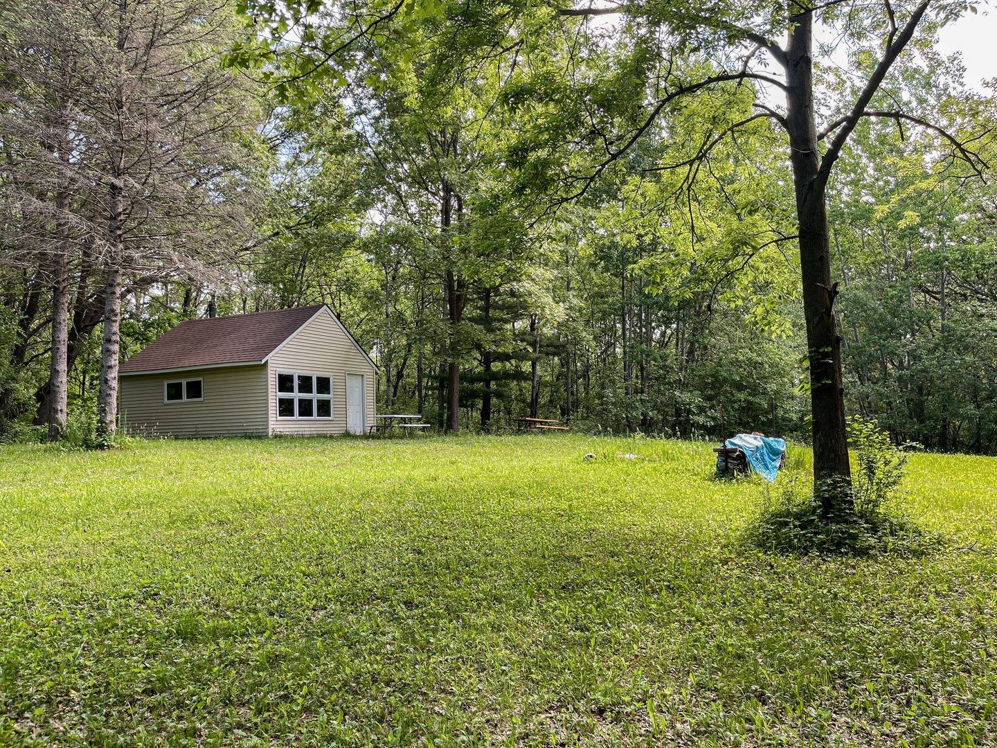 0 Three Mile Road Savanna, IL 61074 - Photo 16 of 32 a front view of a house with garden