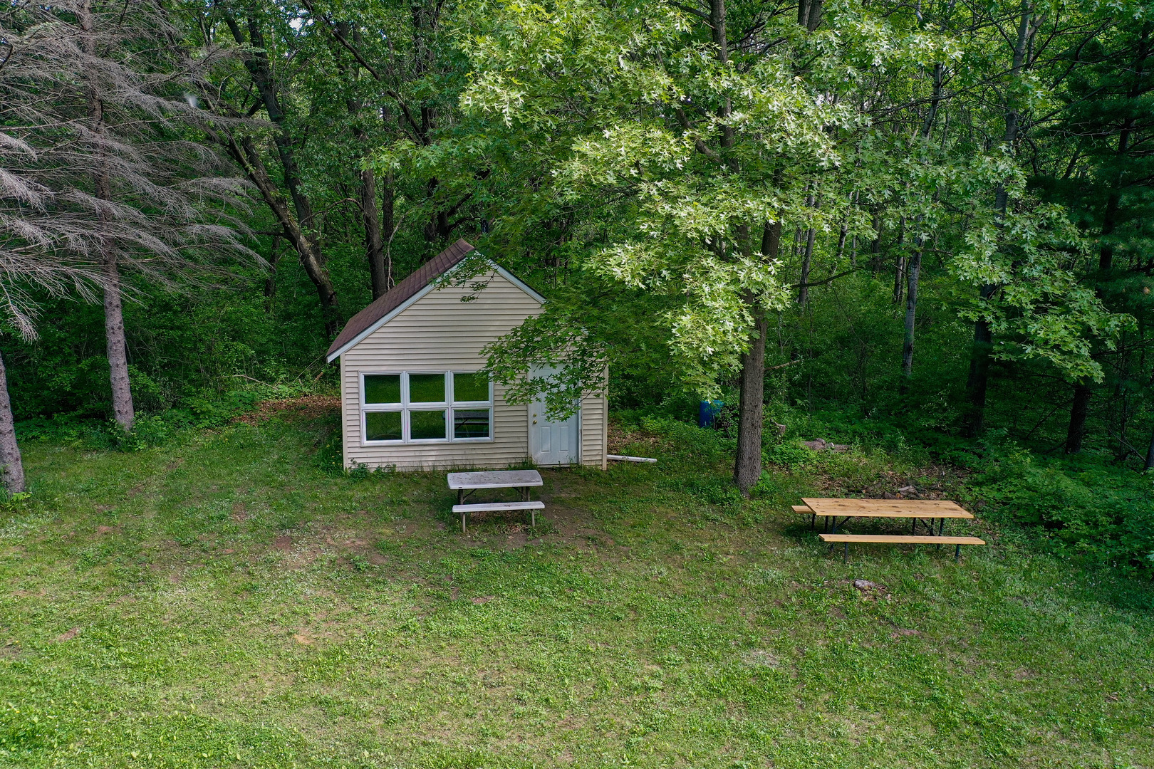 0 Three Mile Road Savanna, IL 61074 - Photo 7 of 32 a front view of a house with a garden