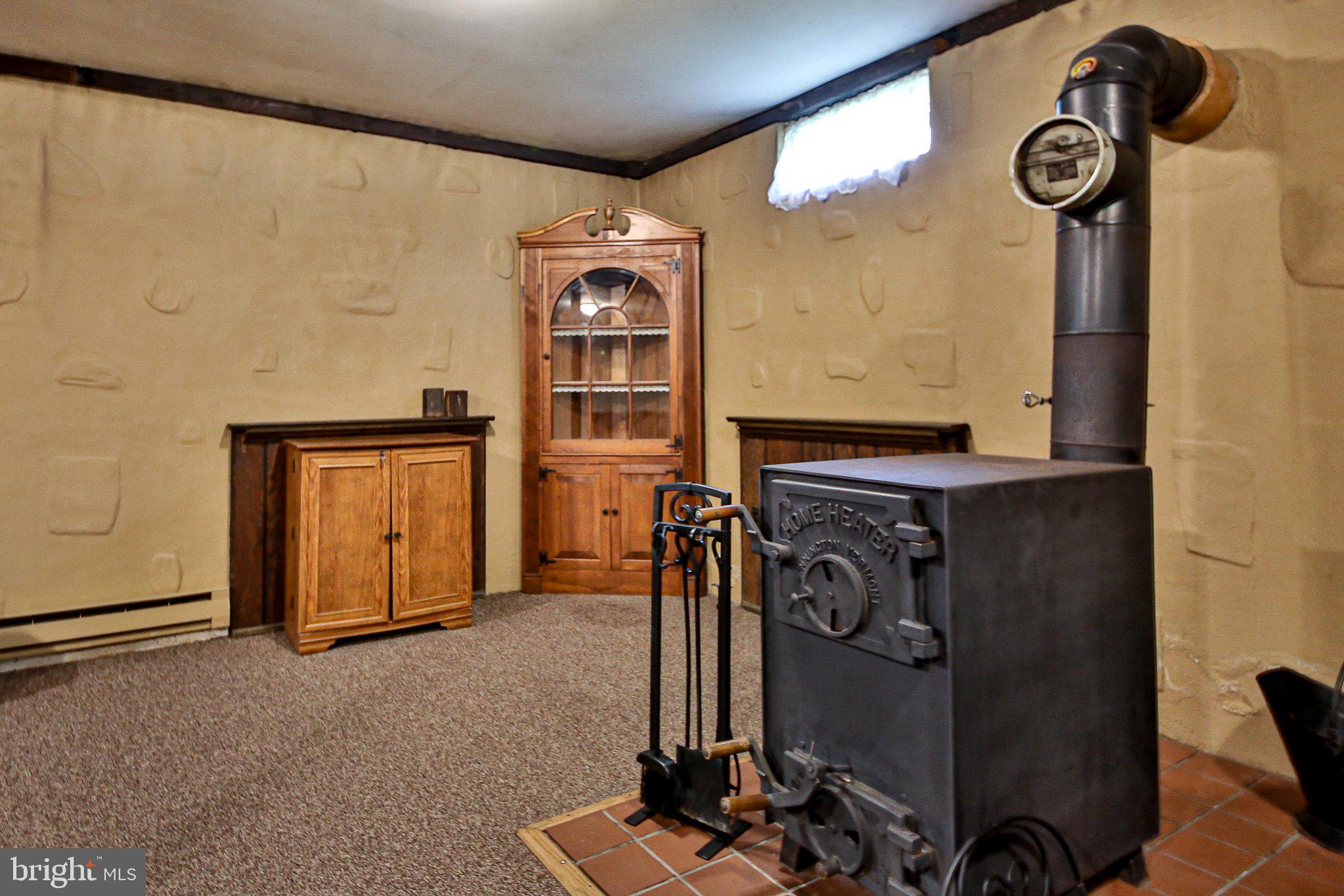 3134 Wild Run Road Pennsburg, PA 18073 - Photo 15 of 33 Coal or wood stove in finished lower level