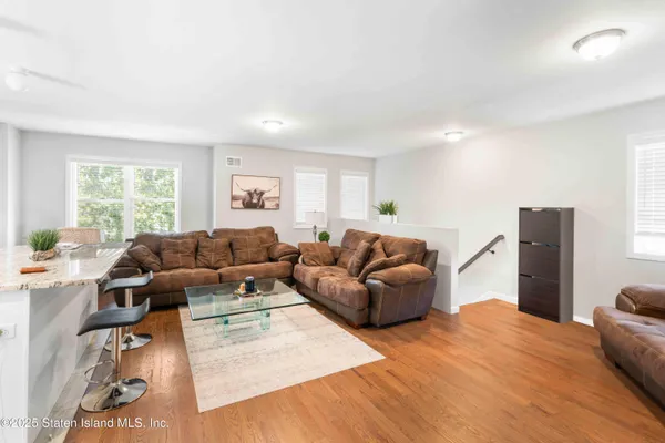 a living room with furniture window and a table