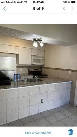 a bathroom with a toilet a sink and a mirror