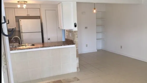 a room with a sink and a mirror