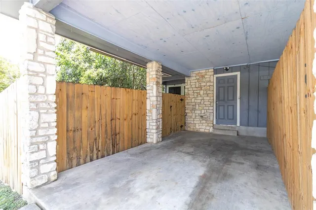 a view of a porch with wooden floor and outer view