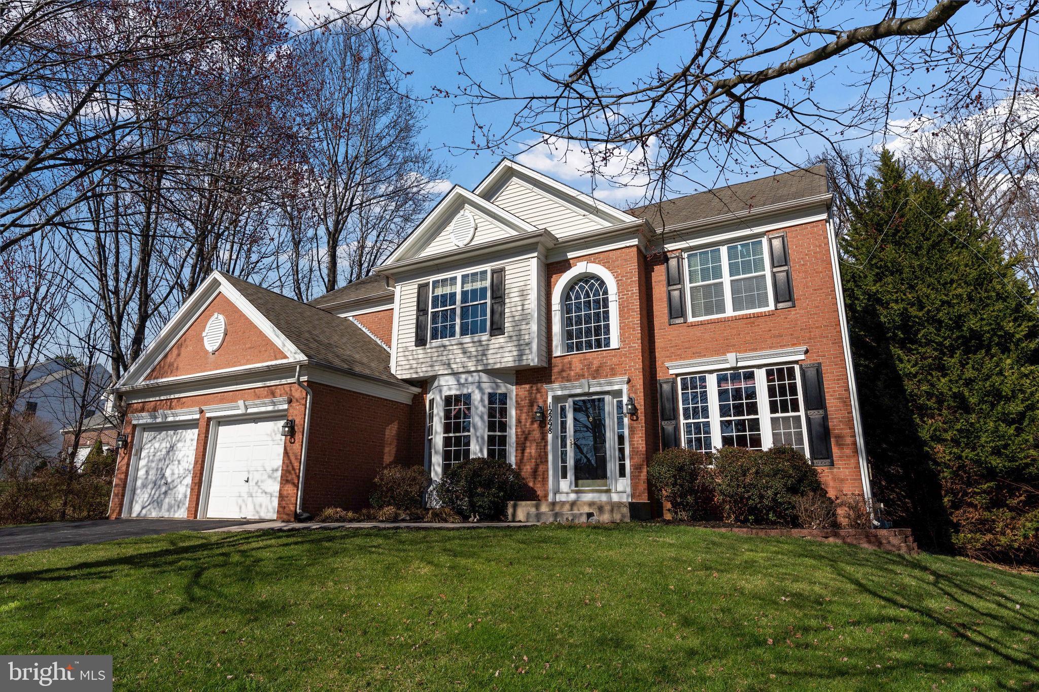 12298 Wake Forest Road Clarksville, MD 21029 - Photo 1 of 46 a front view of a house with a yard