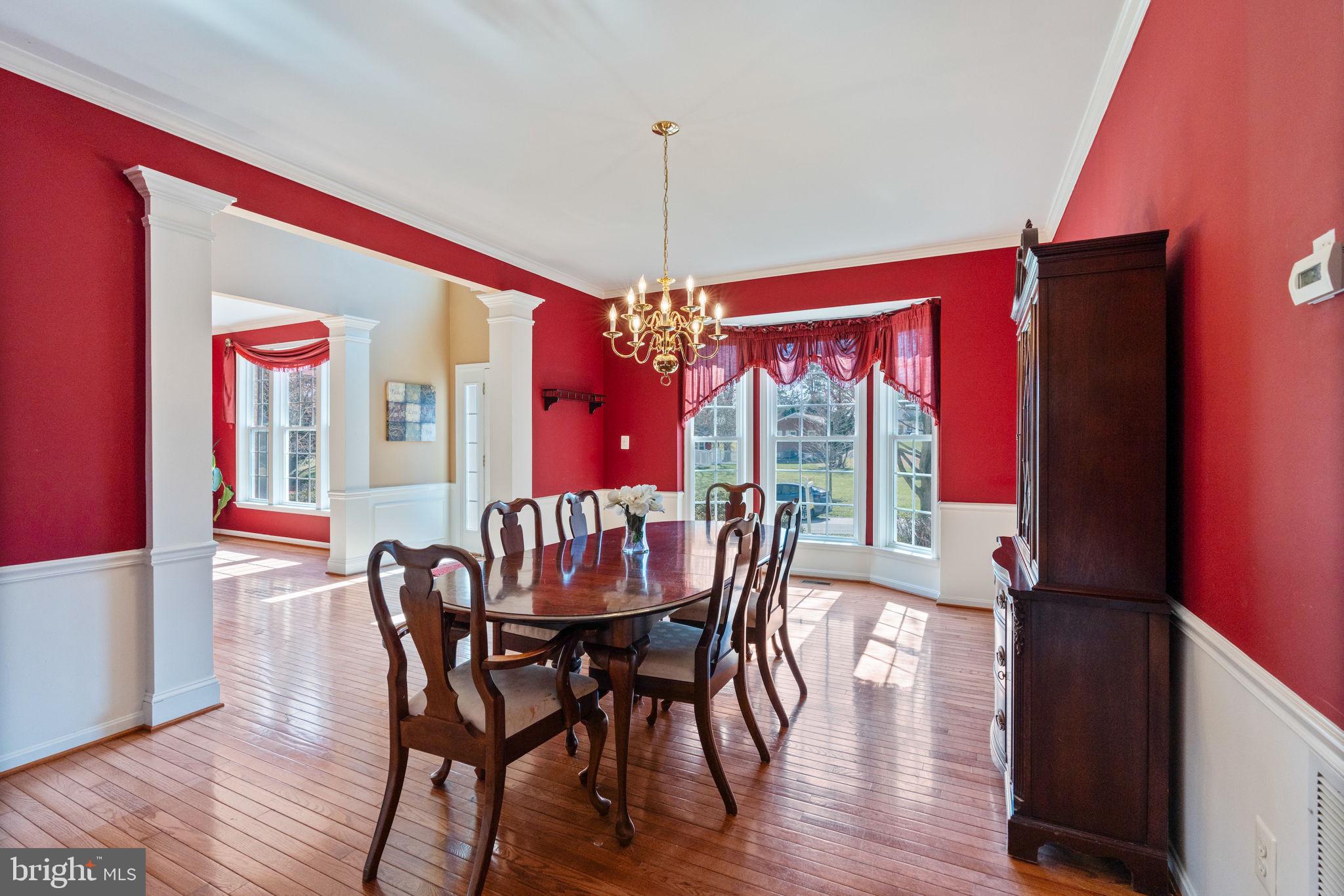 12298 Wake Forest Road Clarksville, MD 21029 - Photo 13 of 46 a view of a dining room with furniture window and wooden floor