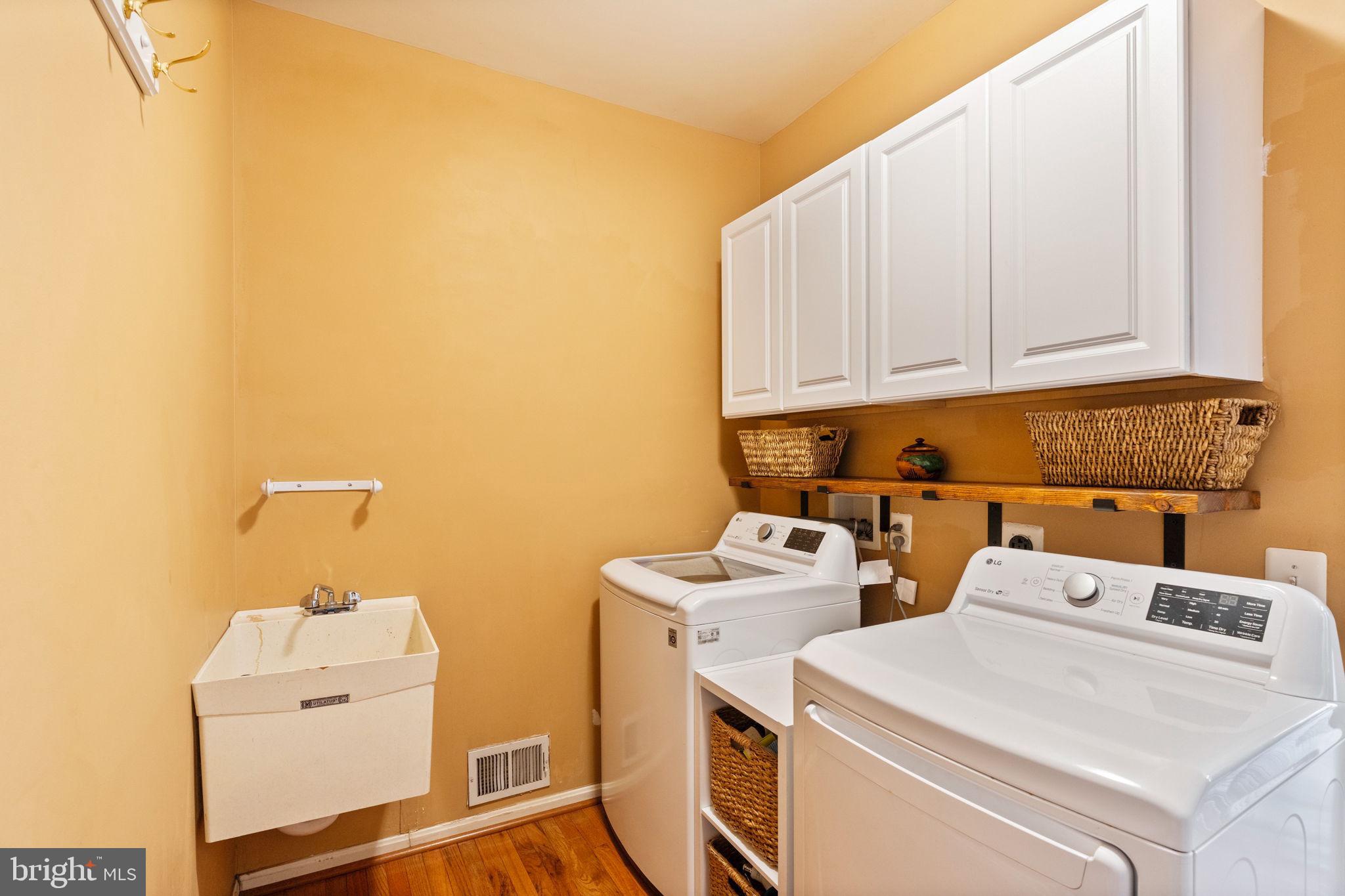 12298 Wake Forest Road Clarksville, MD 21029 - Photo 17 of 46 a utility room with dryer and washer