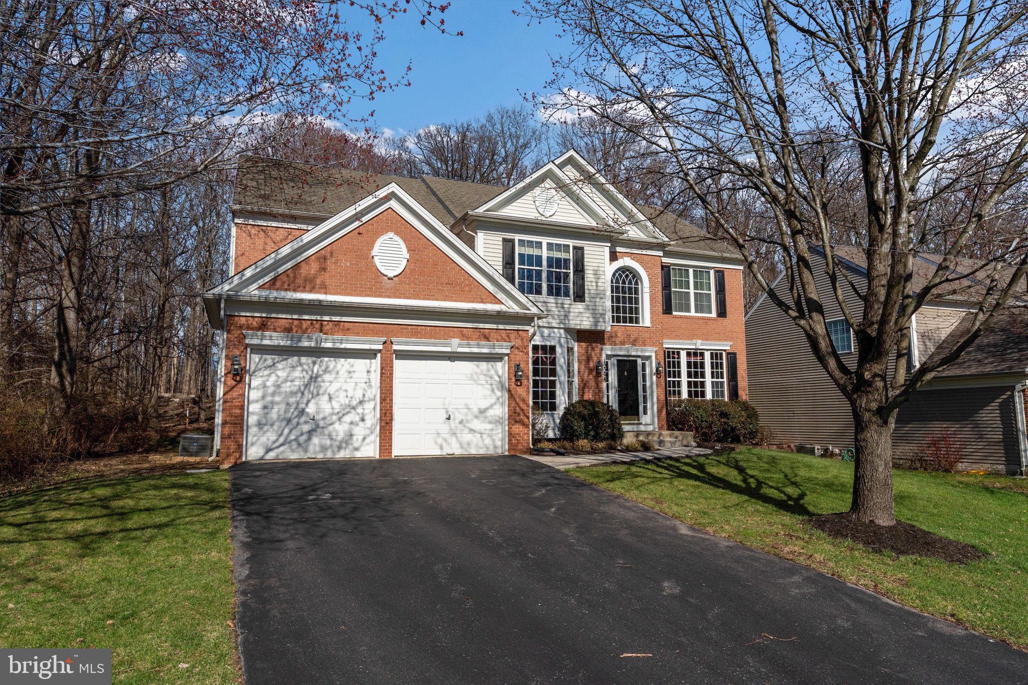 12298 Wake Forest Road Clarksville, MD 21029 - Photo 2 of 46 a front view of a house with a yard